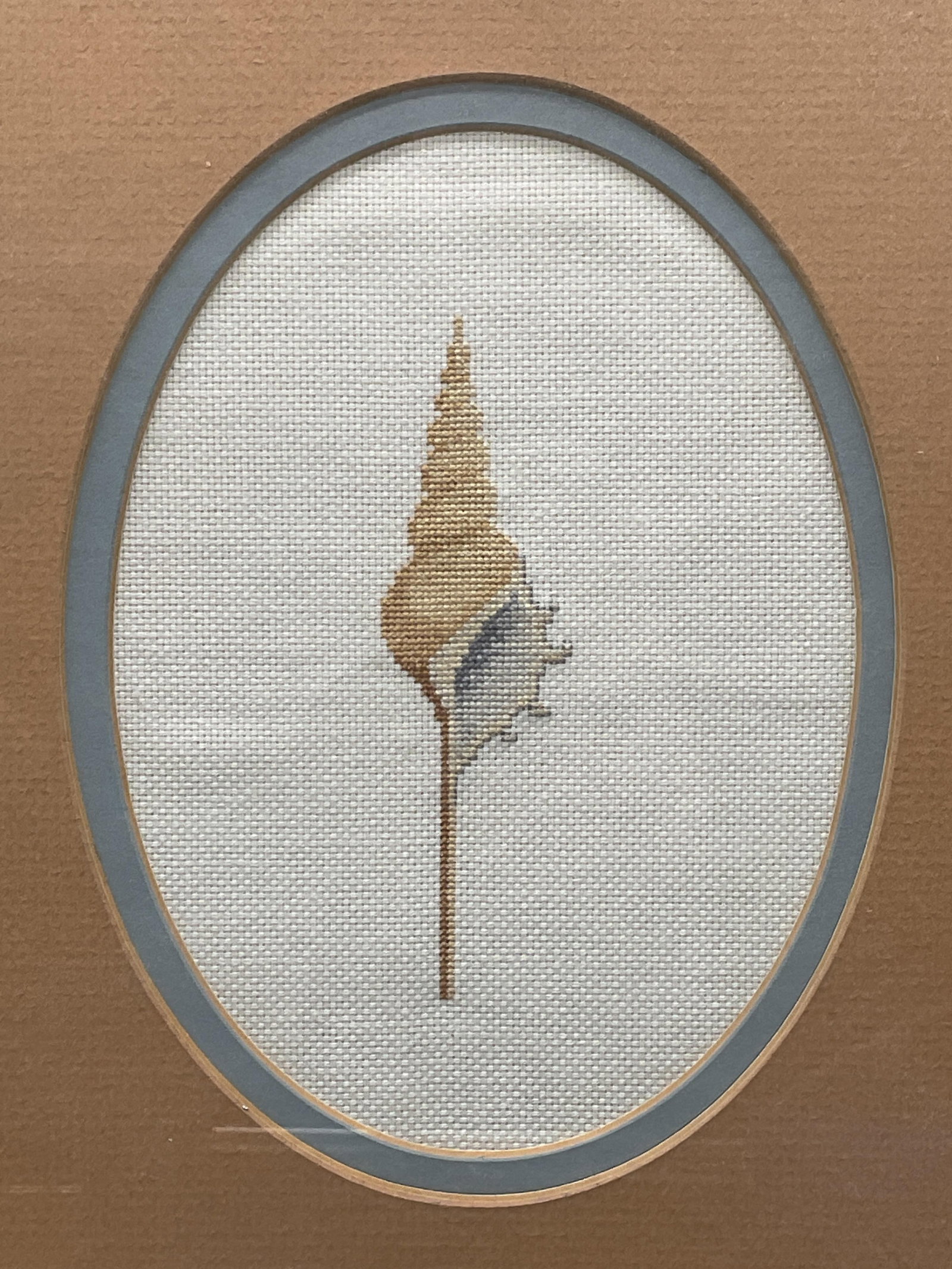Framed Needlepoint Seashell Panel: Framed and matted needlepoint panel. Seashell motif. Gold tone frame. Not examined out of frame. Frame measures approx. 10.5 x 8.5 inches. Glass needs replacement. Art, framed art, needlepoint panel, 