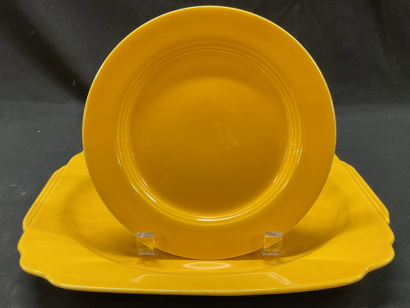 Lot 2 Vintage Yellow Ceramic Plate & Platter: Lot of 2 vintage yellow ceramic plate and platter. No visible markings. Scalloped edge. Yellow with glossy finish. Largest measures approx 9.5 x 11.5 inches. Some scratching. Platter, plate, tableware