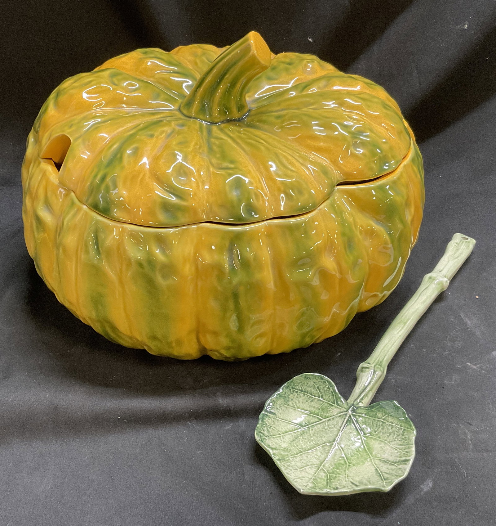 Ceramic Yellow & Green Pumpkin Tureen+ ITALY: Ceramic Yellow & Green Pumpkin Tureen. Green Ceramic Cabbage Shaped Spoon Made in Italy Included. Condition Consistent with Exposure. Measures app 8.25in H x 10in Diameter. Ceramic Pumpkin, Yellow and