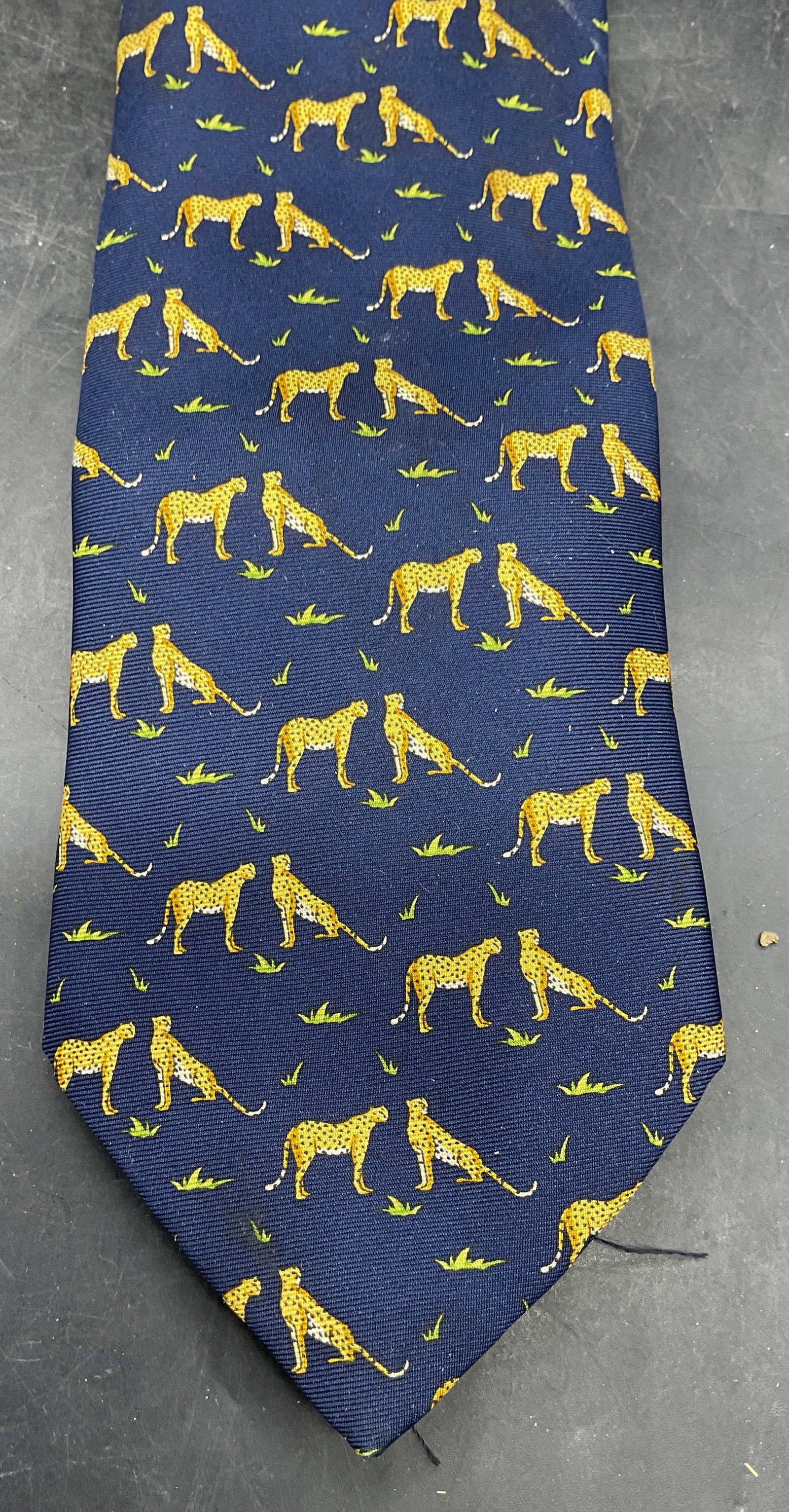 Benjamin James Blue Cheetah Silk Tie England: Benjamin James navy blue cheetah print silk tie. Made in England. Measures approx. 56 inches. Some blemishes. Tie, silk tie, designer tie, menswear, accessories, fashion accessories, Benjamin James ti