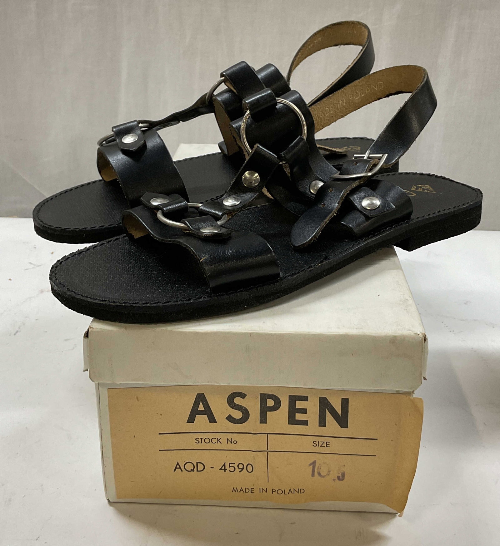 Aspen Black Leather Sandals Poland W Box: Aspen black leather sandals. Comes in original box. Made in Poland. Size 10.5. Black leather. Accented with buckles and unique design. Wear consistent with exposure. Sandals, Aspen, shoes, wearables, 
