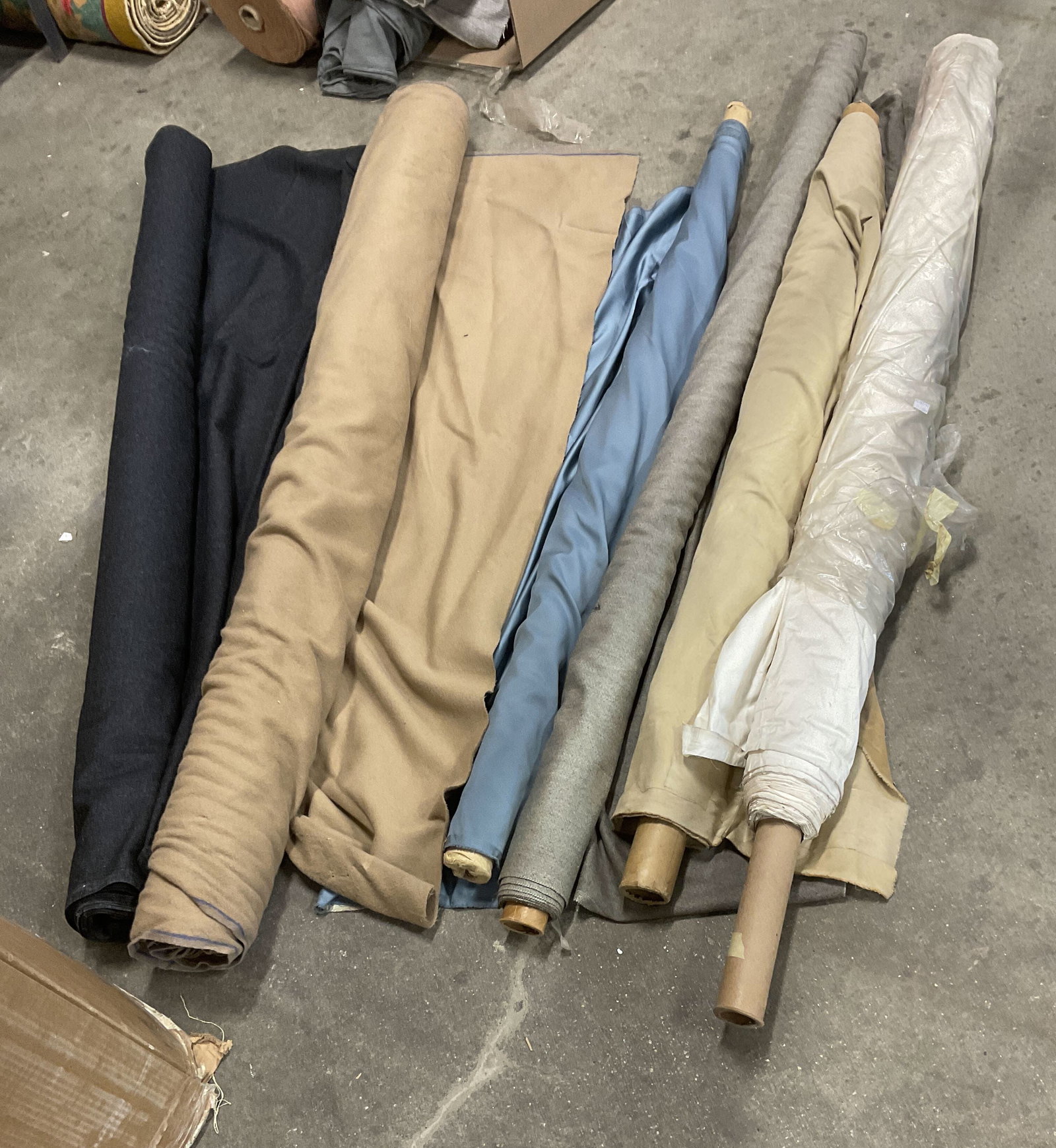 Lt 6 Solid Bolts of Fabric: Lt 6 Solid Bolts of Fabric. Mixed Materials. Wool, Cotton, Silk and More. Brown, Black, Blue, Brown, Beige, and White. Not Measured, Unrolled, or Inspected. Sold As Is. Part of Large Collection of NYC