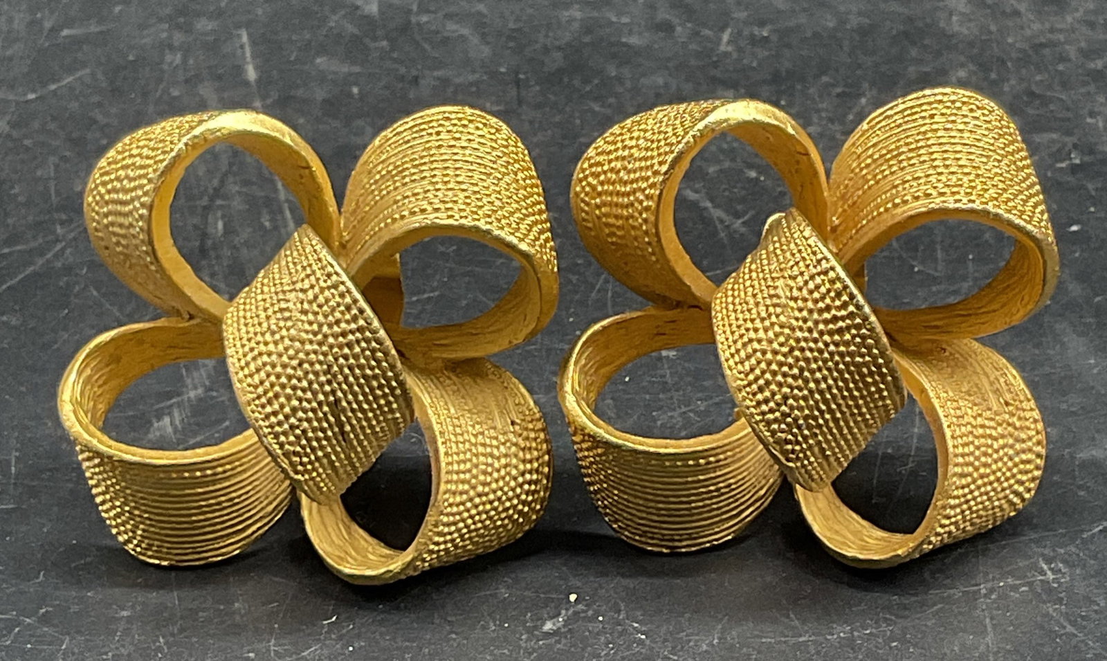 Vintage Gold Tone Bow Ribbon Earrings: Vintage gold tone bow ribbon motif earrings. Measures approx. 1.25 x 1.5 inches. Some scratching. Jewelry, estate jewelry, costume jewelry, fashion jewelry, cocktail jewelry, accessories, fashion acce