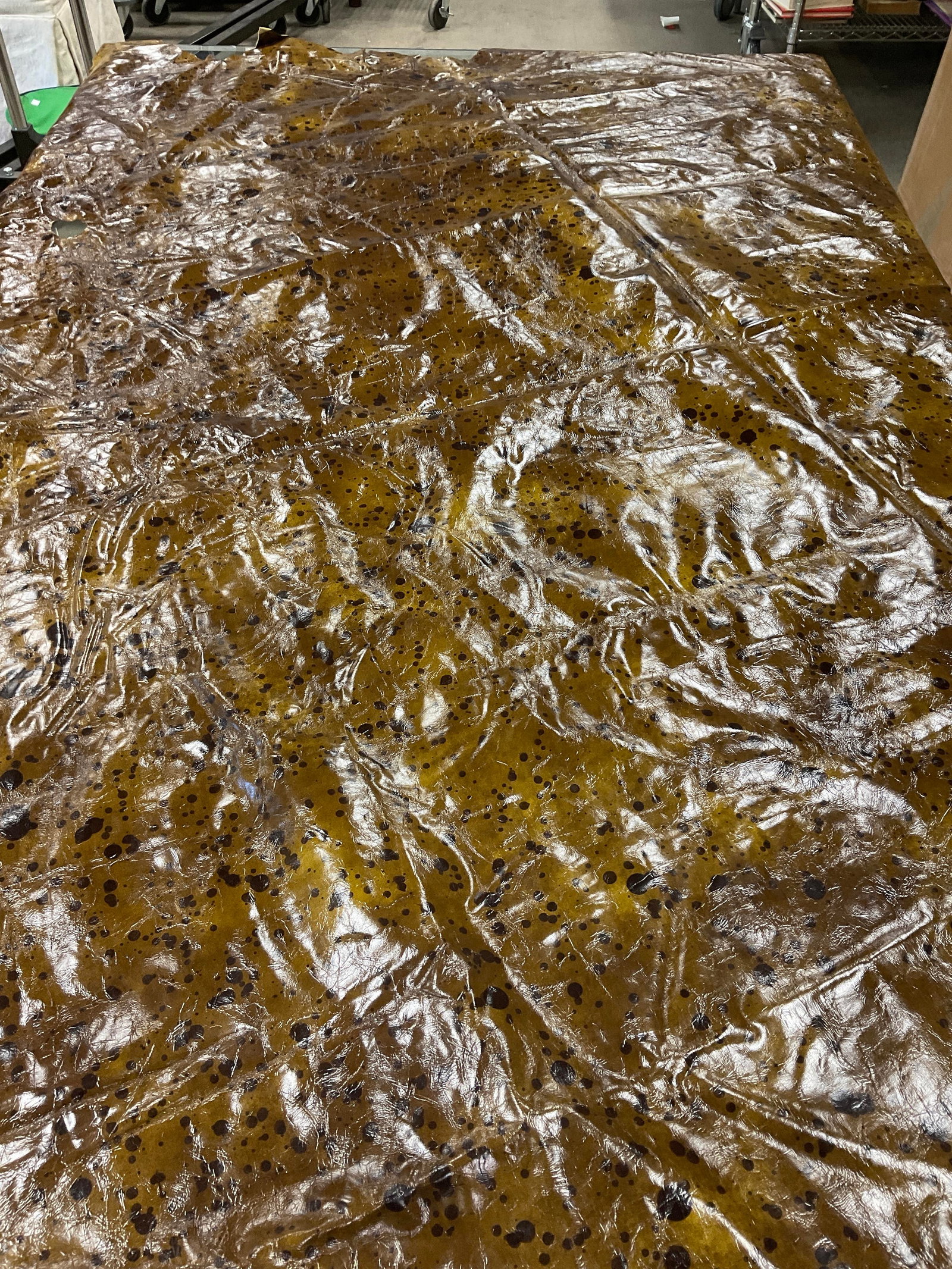 Large Piece Brown and Caramel Toned Leather: Large Piece of Brown and Caramel Toned Leather Scrap. Appears to be Hand painted. Flip Side Appears to be Suede with Streaks of Yellow Paint. Measures app 94in x 76in. Sold As Is. Part of Large Collec