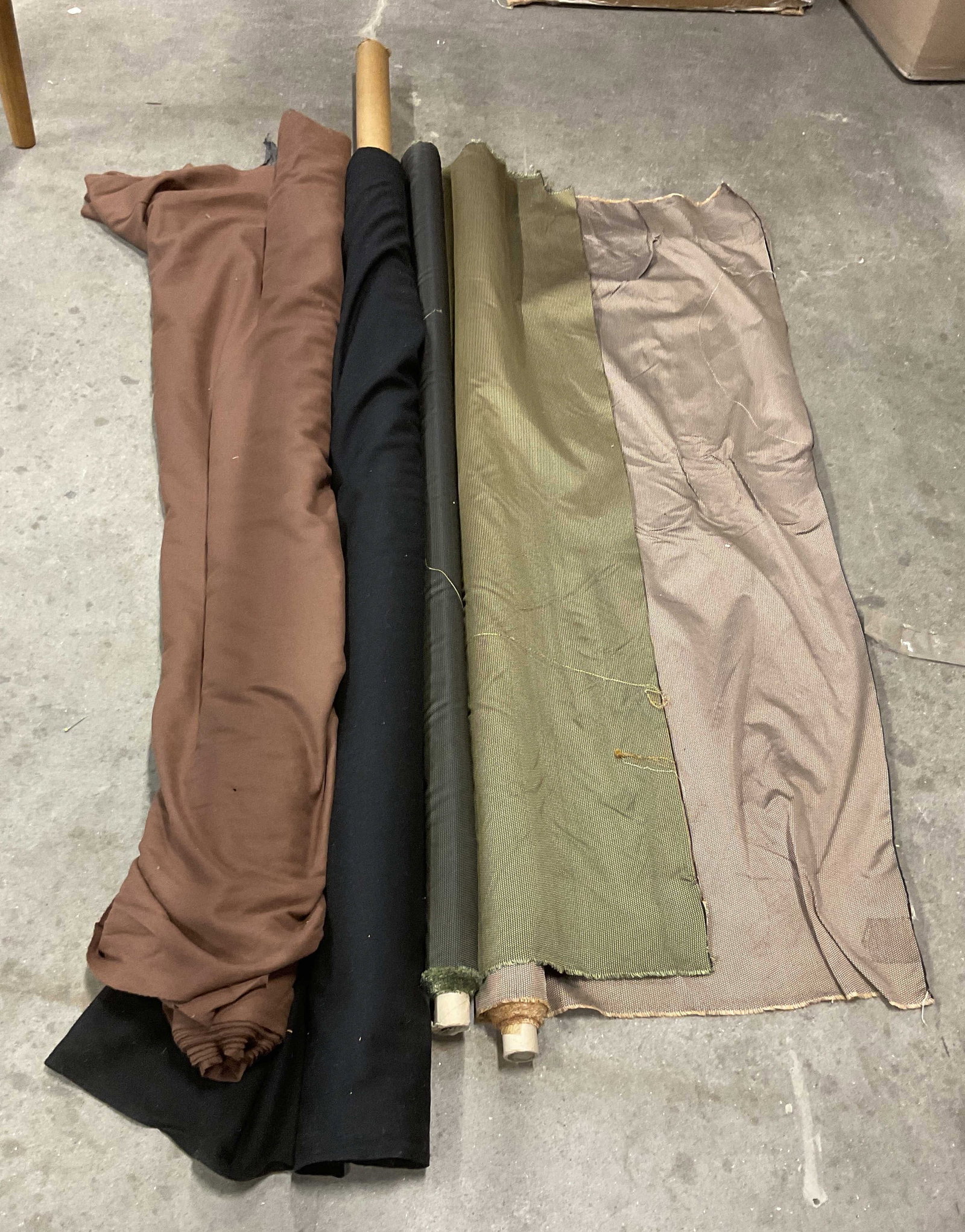 Lt 4 Solid & Textured Patterned Bolts of Fabric: Lt 4 Solid & Textured Patterned Bolts of Fabric. Mixed Materials. Wool, Cotton, Silk and More. Brown, Black, Green, and Brown. Not Measured, Unrolled, or Inspected. Sold As Is. Part of Large Collectio