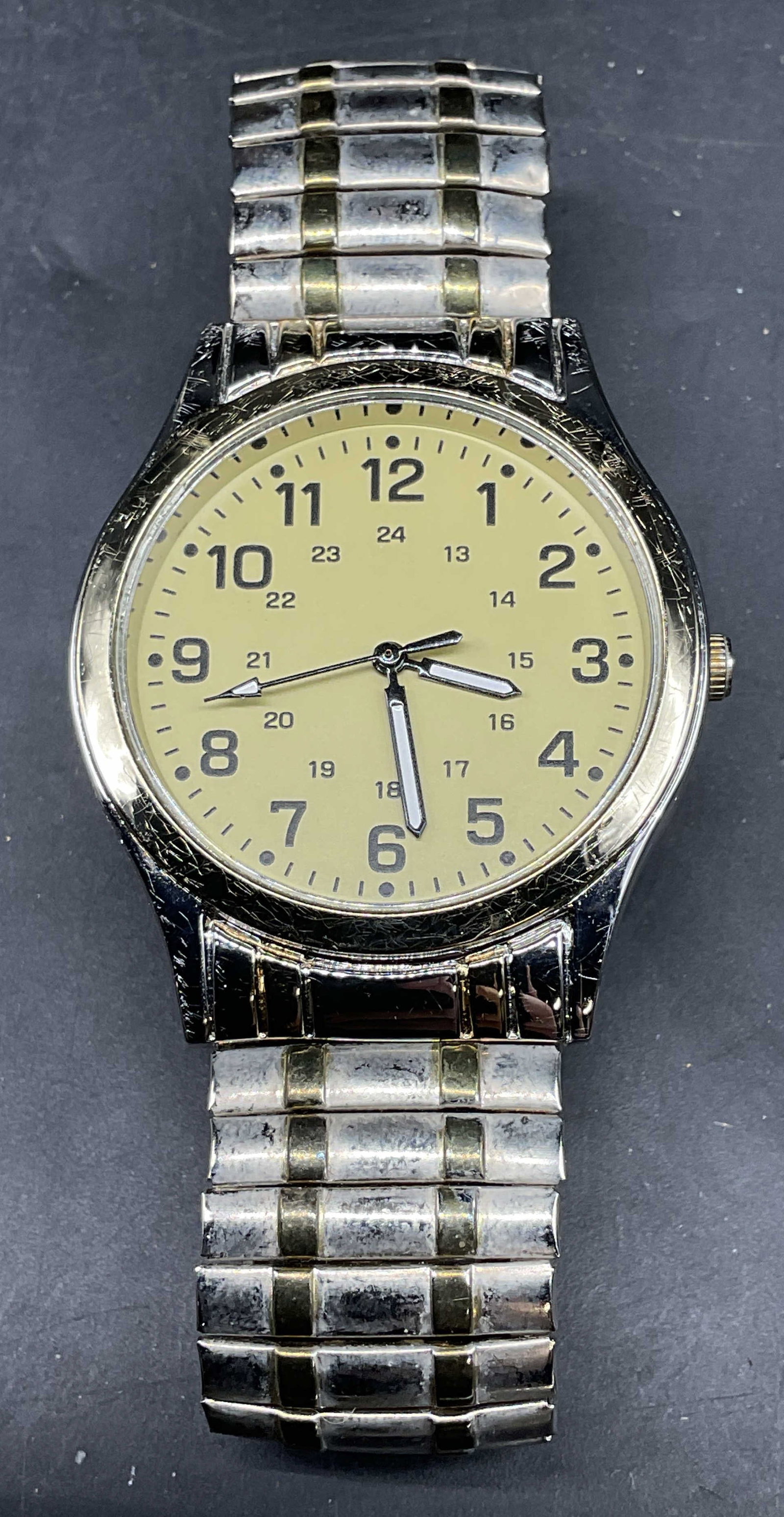 Gold & Silver Tone Yellow Dial Watch: Gold tone and silver tone stretch band watch with yellow dial. Measures approx. 2.5 inches wide. Not tested. Some scratching. Jewelry, estate jewelry, costume jewelry, cocktail jewelry, fashion
