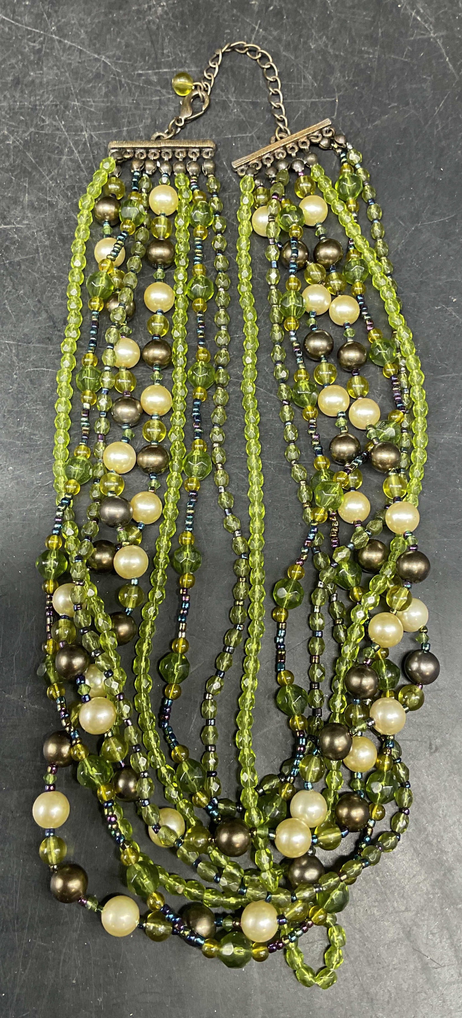 Vintage Green Crystal Faux Pearl Necklace: Vintage multi strand green crystal and faux pearl beaded necklace. Drop length measures approx. 8.5 inches. Some scratching. Jewelry, estate jewelry, costume jewelry, cocktail jewelry, fashion