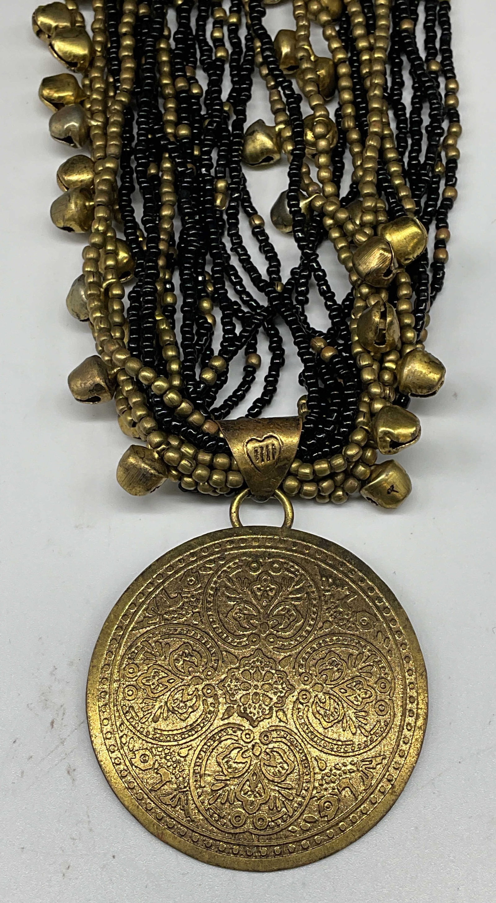 Vintage Gold Tone Black Beaded Necklace: Vintage gold tone and black beaded necklace ornate disc pendant. Drop length 10 inches. Some scratching. Jewelry, estate jewelry, costume jewelry, cocktail jewelry, fashion jewelry, accessories,