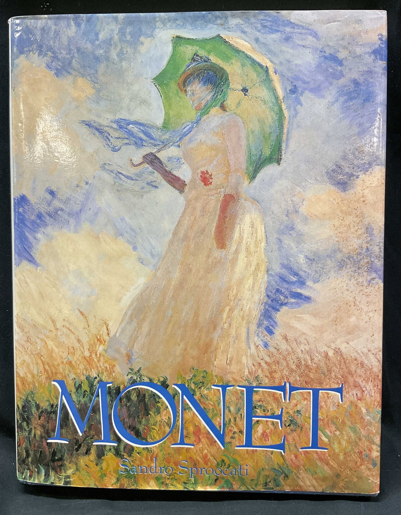 1992 Monet Illustrated Book Sproccati+: Claude Monet by Sandro Sproccati. Published by Mallard Press, 1992. Hard cover book with illustrated cover. Contains illustrations. Measures approx 11 x 14 inches. Surface wear consistent with exposur