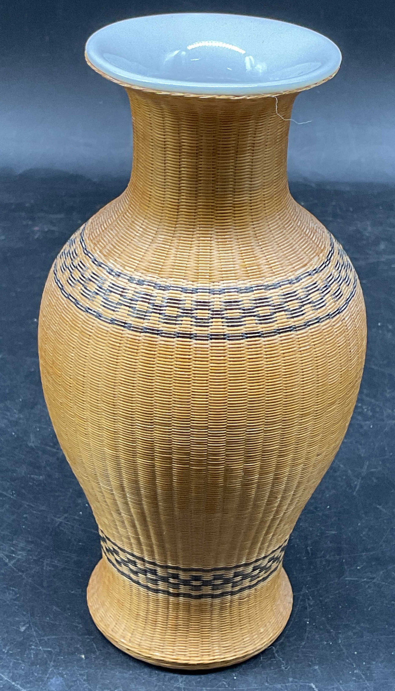 Vintage Chinese Bamboo & Porcelain Vase: Vintage woven bamboo over porcelain vase. Marked made in Peoples Republic of China. Measures approx. 3.25 x 6.5 inches. Some scratching. Chinese vase, bamboo vase, porcelain vase, home decor, home acc