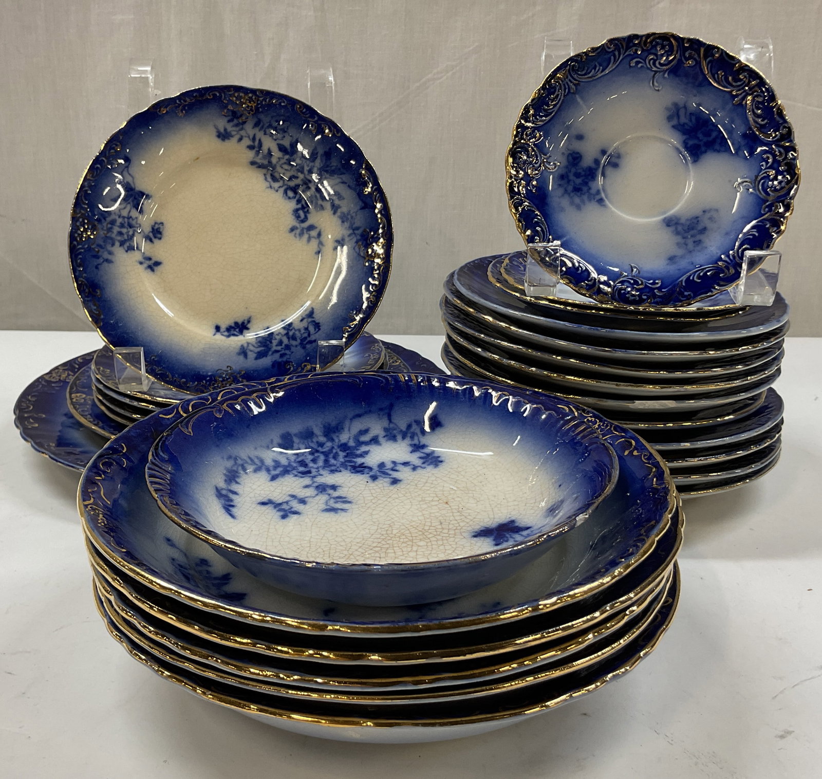Set 26 La Belle Fine China Blue & White Tableware: 26 piece La Belle Fine China blue and white tableware set. Marked La Belle China on underside. Includes 10 large saucers, 3 small saucers, 1 dinner plate, 1 lunch plate, 5 salad plates, 1 small bowl, 
