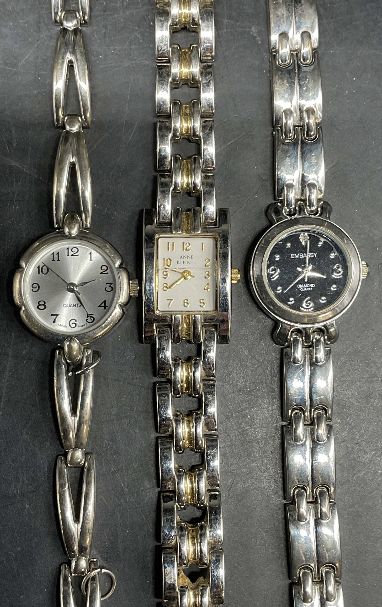 Lot 3 Anne Klein, Embassy Silver Tone Watches: Lot of 3 silver tone chain band watches. 1 signed Anne Klein II. 1 signed Embassy. Longest approx 8 inches. Not tested. Some scratching. Jewelry, estate jewelry, costume jewelry, cocktail jewelry, fas