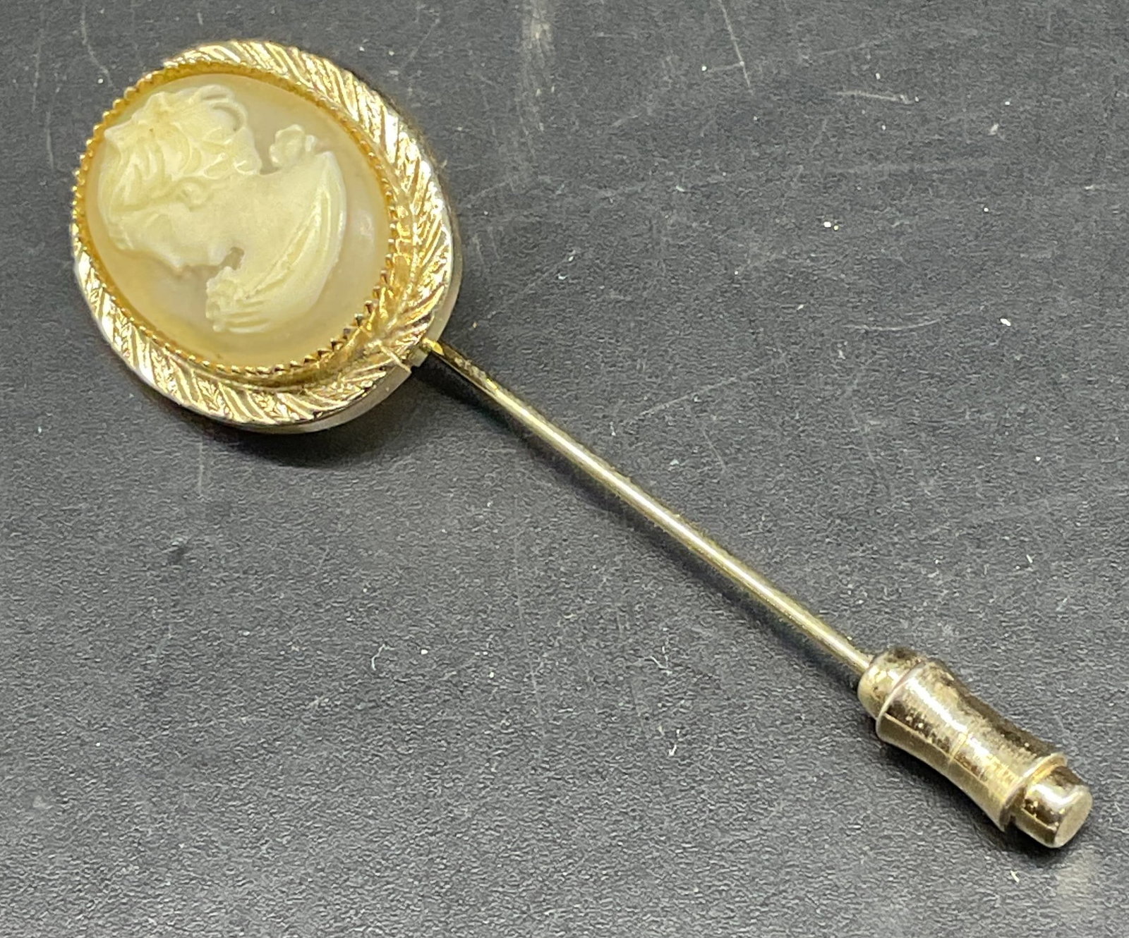 Vintage Gold Tone Cameo Stick Pin: Vintage gold tone stick pin with cameo motif. Measures approx. 2.25 x 5/8 inches. Some scratching. Jewelry, estate jewelry, costume jewelry, cocktail jewelry, fashion jewelry, accessories, fashion acc