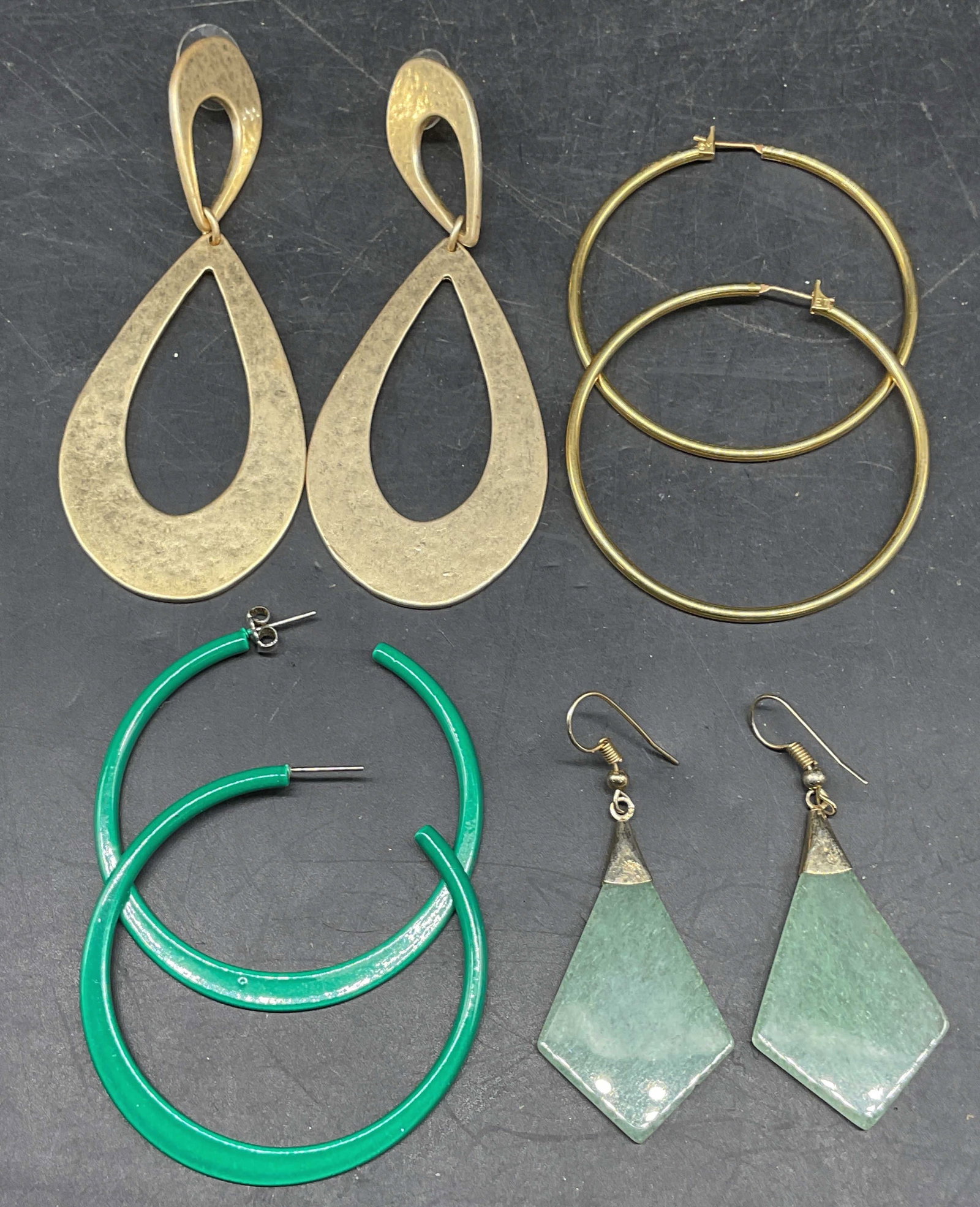 Lot 4 MET Hoop Earrings, Jade Earrings +: Lot of 4 pairs of earrings. Signed MET gold tone hoop earrings, signed R gold tone teardrop earrings, gold tone and jade earrings, green enameled hoop earrings. Largest measures approx. 3.5 inches