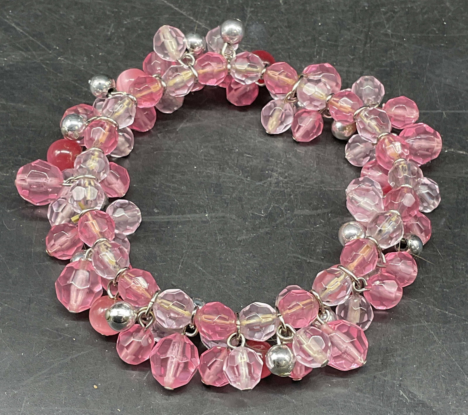 Vintage Silver Tone Pink Crystal Beaded Bracelet: Vintage pink crystal beaded bracelet with silver tone accents. Stretch band. Measures approx. 2.5 inches wide. Some scratching. Jewelry, estate jewelry, costume jewelry, cocktail jewelry, fashion