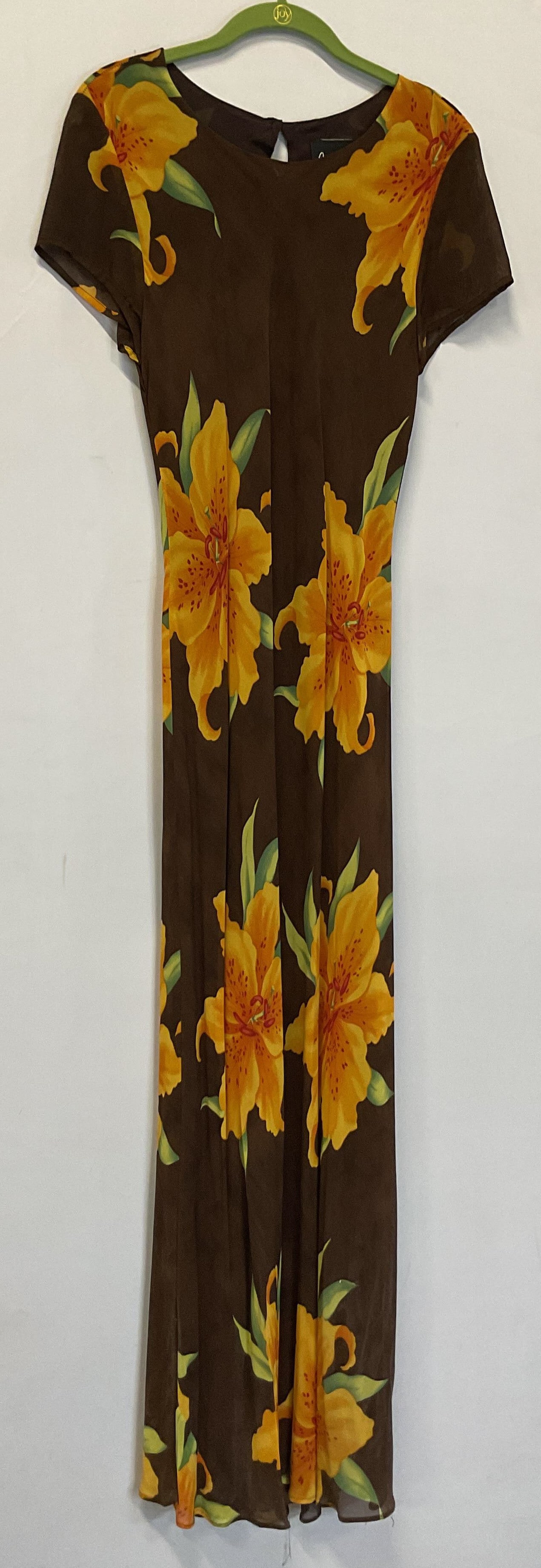 Benjamin A Brown Floral Maxi Dress USA: Benjamin A brown floral maxi dress. Made in USA, Los Angeles CA. Size 12. 100% rayon. Brown with yellow and green floral motifs. Wear consistent with exposure. Property of opera singers estate from th