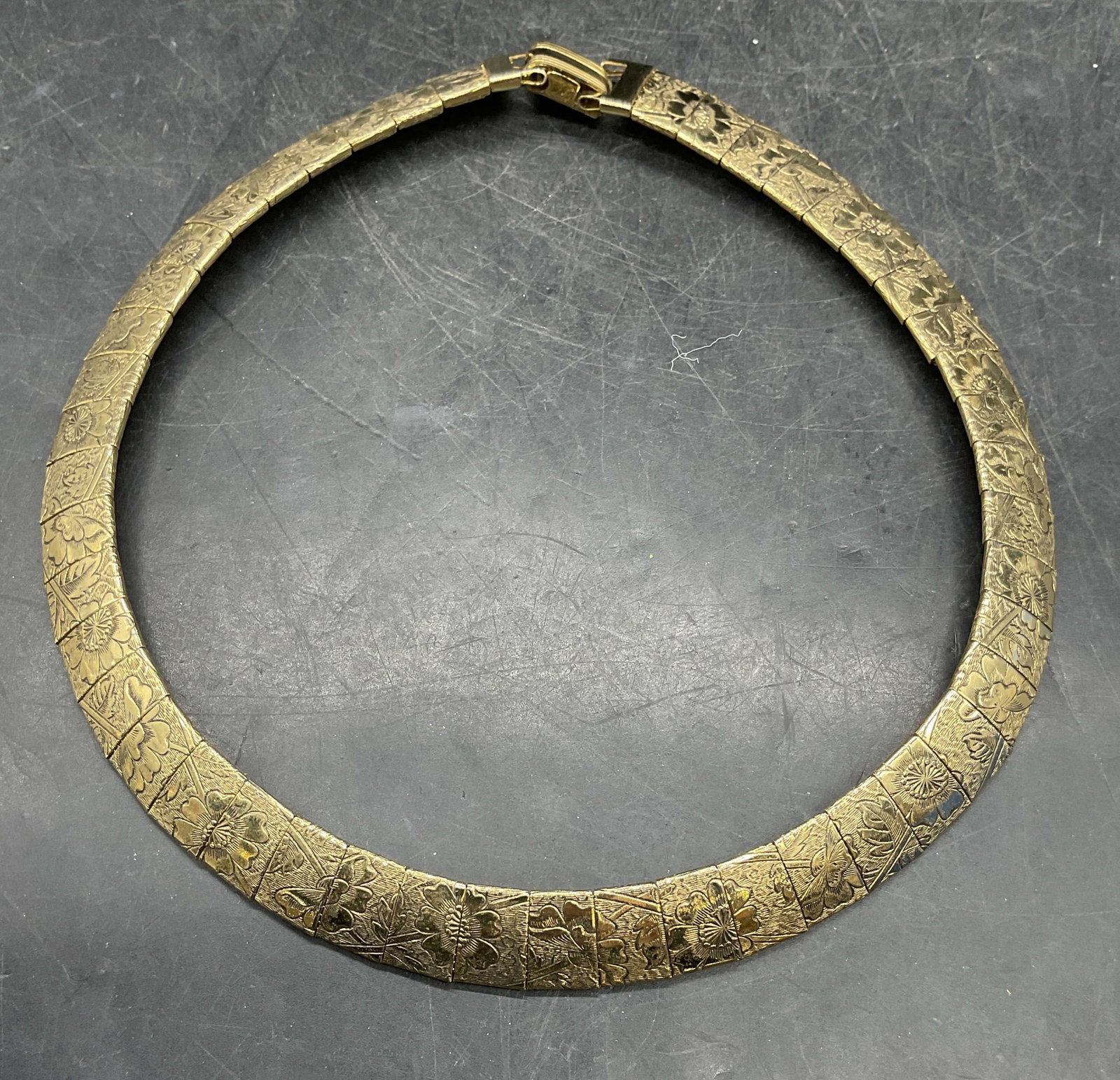 Vintage Gold Tone Floral Collar Choker Necklace: Vintage gold tone omega collar choker necklace with floral motif. Measures approx. 4.75 inches wide. Some scratching. Jewelry, estate jewelry, costume jewelry, cocktail jewelry, fashion jewelry, acces