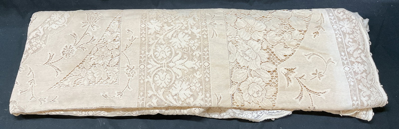 Vintage Beige Lace Tablecloth: Vintage beige lace tablecloth. Lace material. Scalloped trim. Ornate floral and scroll motifs. Measures approx 36 x 54 inches. Blemished observed. Lot sold as is. Tablecloth, table linens, linens, vin