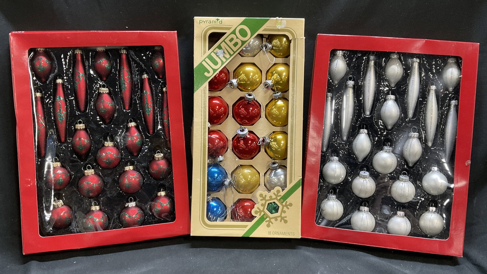 Lt 3 Boxes of VTG Glass Christmas Ornaments: 3 Boxes of Vintage Glass Christmas Ornaments. Includes Pyramid Rauch Industries Multicolor Balls and 2 Yule Rite Red and Silver Ball and Icicle Shaped Ornaments. Some Scratching and Fading. Missing on