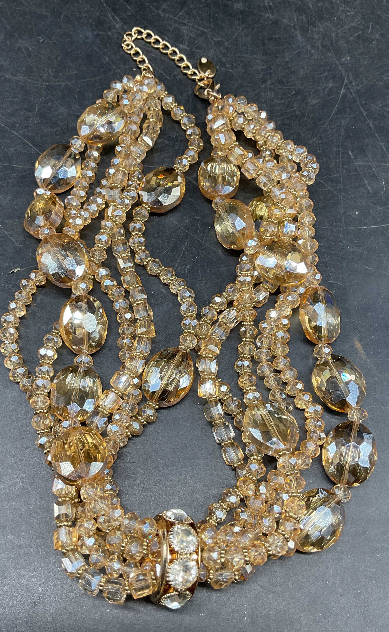 Vintage Gold Tone Crystal Necklace: Vintage gold tone multi strand crystal beaded necklace. Drop length approx 9 inches. Some scratching. Jewelry, estate jewelry, costume jewelry, cocktail jewelry, fashion jewelry, accessories, fashion 