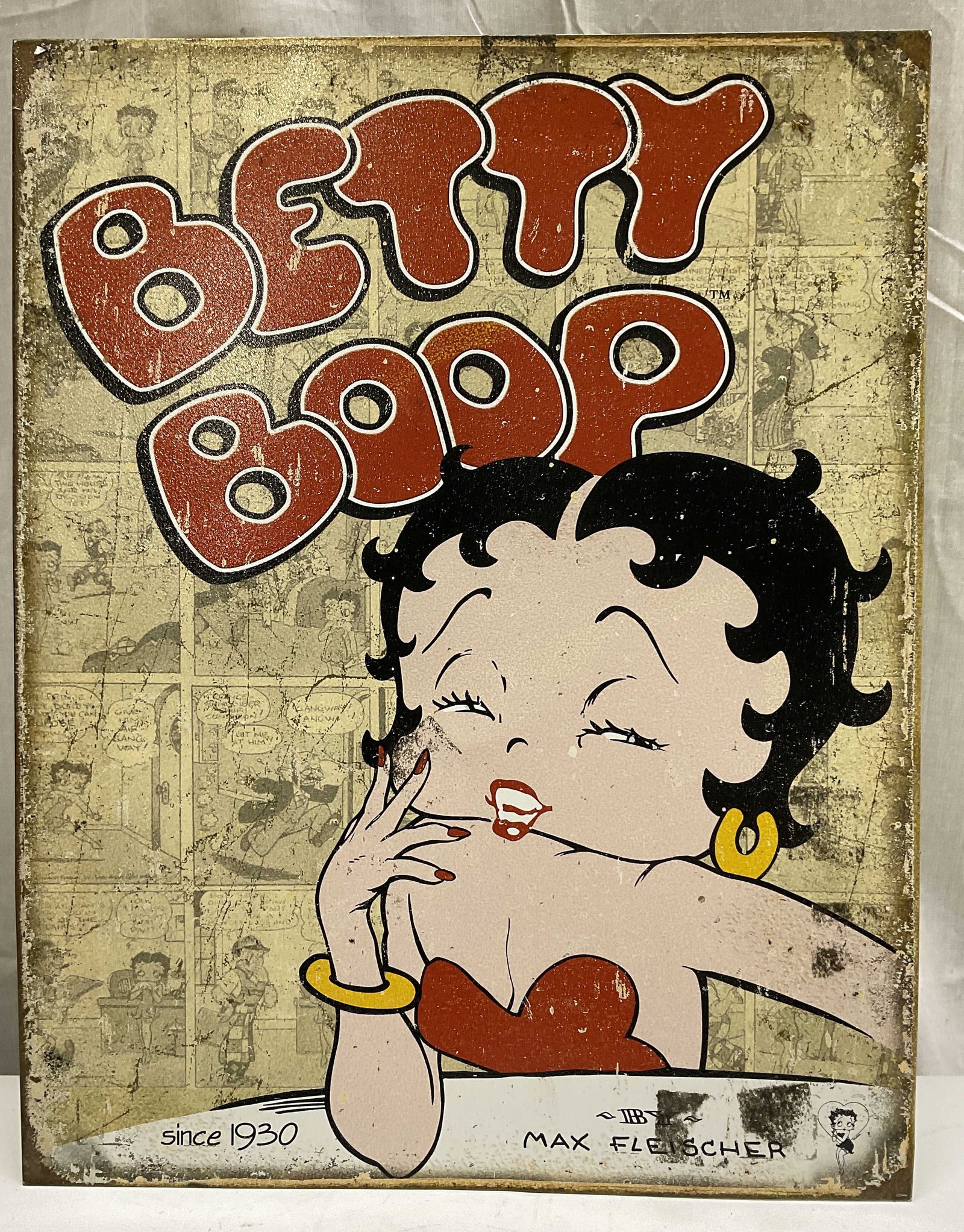 2011 Fleischer Studios Betty Boop Tin Sign: 2011 King Features Syndicate/Fleischer Studios Inc. TM Hearst Holdings Inc. Betty Boop Tin Sign. Produced by Desperate Enterprises Inc. Some Residue. Measures app 16in H x 12.5in W. King Features Synd