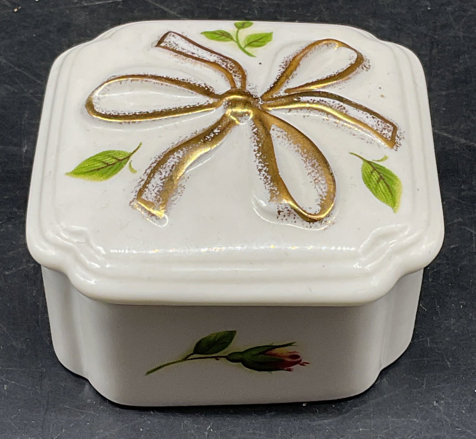 Royal Albert Thinking of You Porc Trinket Box: Royal Albert Thinking Of You porcelain trinket box. Gilt with floral motif. Measures approx. 2.5 x 2.5 x 1.25 inches. Some scratching. Royal Albert trinket box, porcelain trinket box, home decor, home
