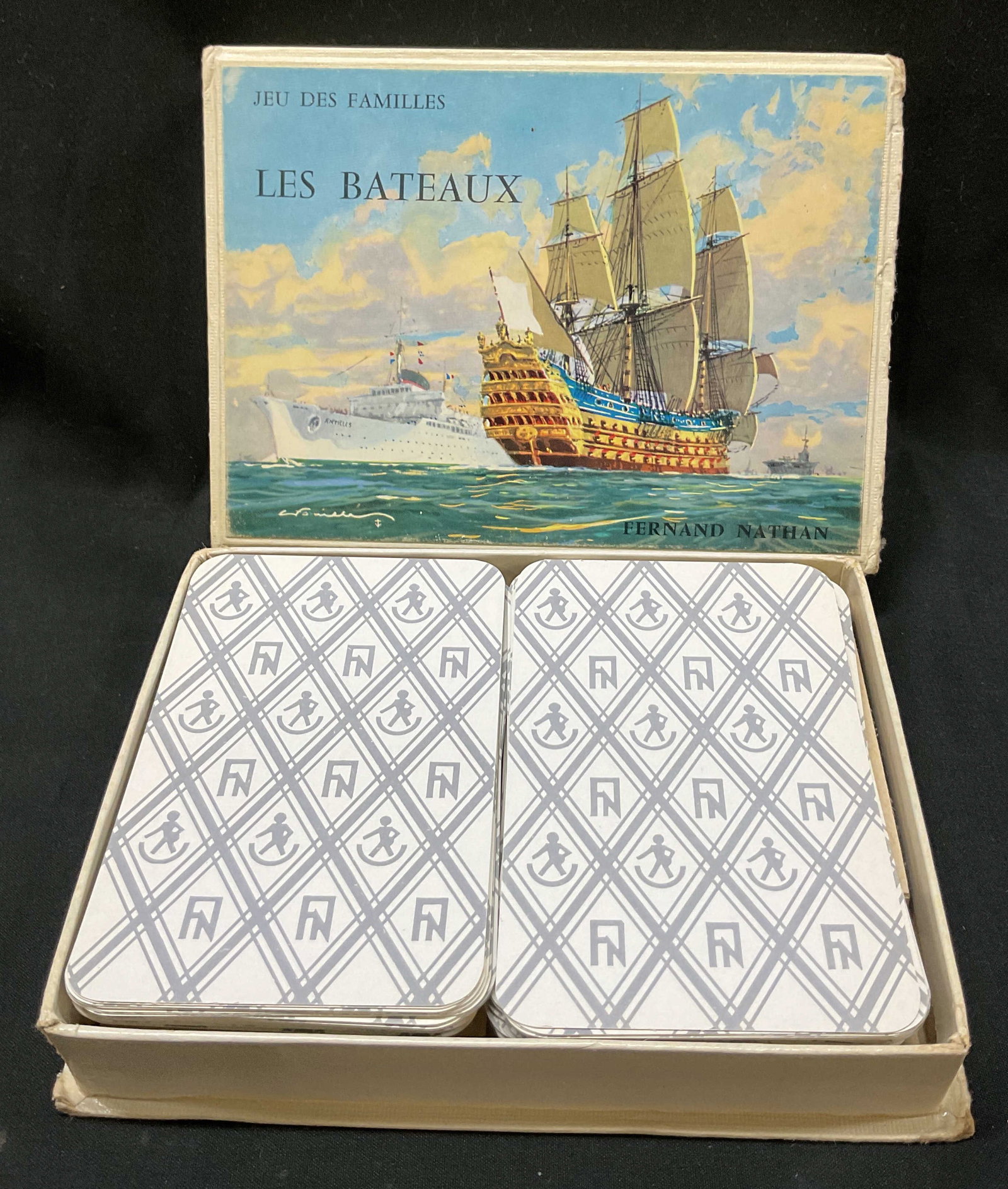 Jeu Des Familles Playing Cards W Box Nathan+: Jeu Des Familles Les Bateaux Fernand Nathan. Playing card game featuring imagery of ships. Comes in original box with case. Total number of cards is 49. Varying colors. Text reads in French. Cards mea