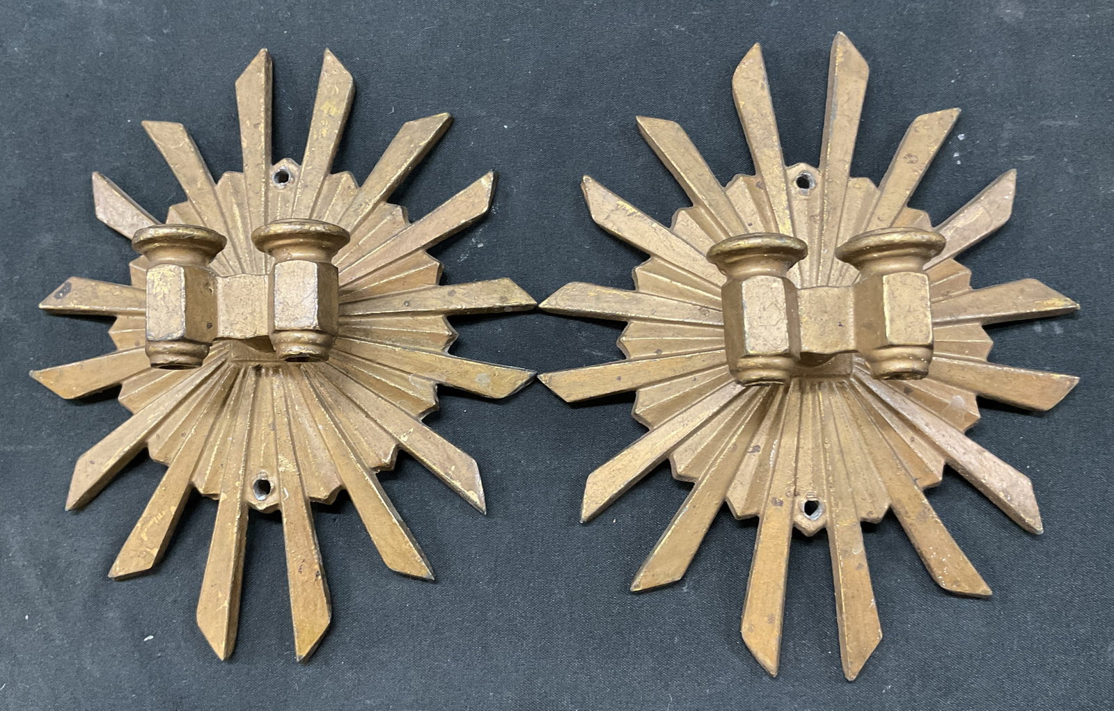Pair Vintage Brass Starburst Wall Sconce: Pair of vintage brass starburst wall sconce. Pointed edges. Starburst design. Holes for mounting. Measures approx 6 x 6 inches. Surface wear consistent with exposure. Wall sconce, wall decor, decor, h