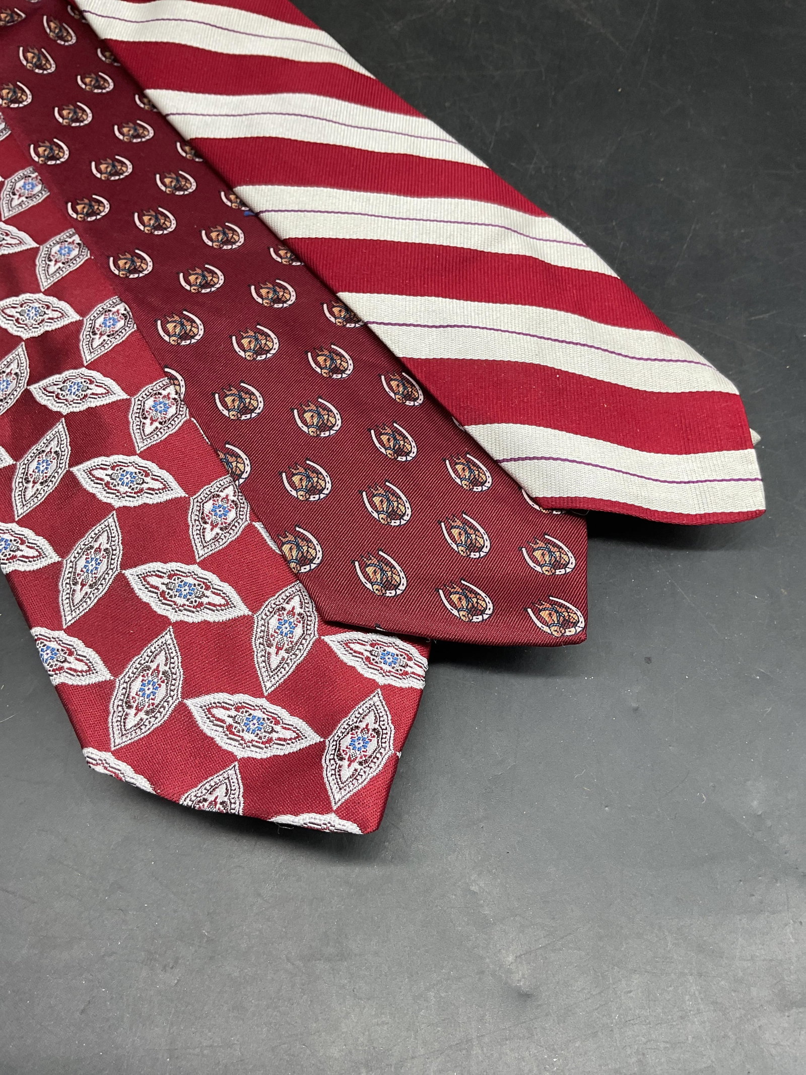 Lot 3 Ralph Lauren Red Striped Silk Tie, Horse Tie: Lot of 3 ties. Polo Ralph Lauren red and white striped silk tie. Bert Pulitzer red horse print silk tie. John Henry red geometric print polyester and silk blend tie. Longest measures approx. 54 inches