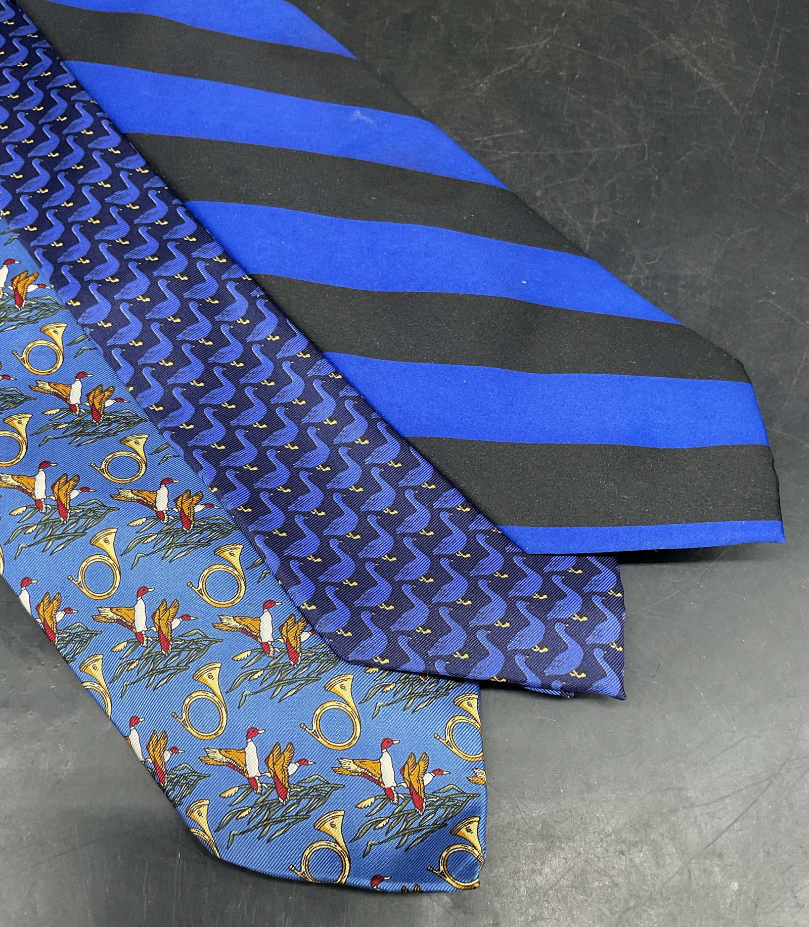 Lot 3 Beaufort Blue Duck Silk Ties Italy +: Lot of 3 blue ties. 2 Beaufort duck print ties, made in Italy. Romario Manzini black and blue striped p microfiber tie. Longest measures approx. 56 inches. Some blemishes. Tie, silk tie, vintage tie, 