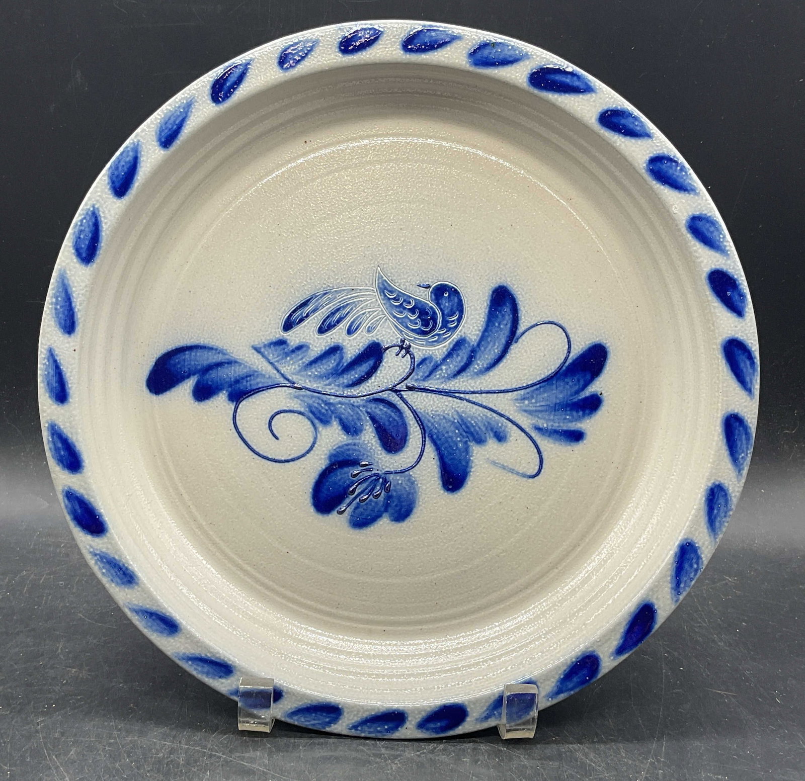 1992 Eldreth Folk Art Stoneware Bird Plate USA: Vintage 1992 signed Eldreth pottery folk art stoneware plate. Blue glaze with bird and botanical motif. Measures approx. 11 inches wide. Made in USA. Some scratching and crazing. Eldreth pottery,
