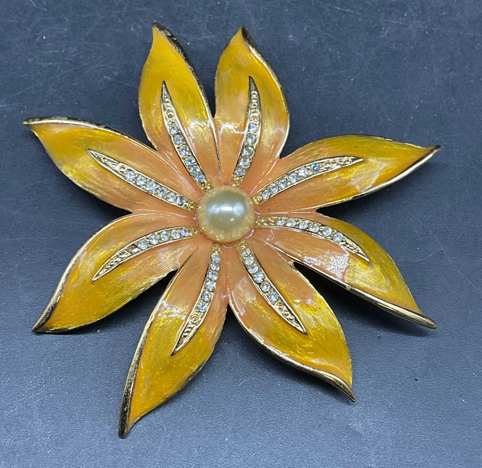 Vintage Gold Tone Enamel Crystal Flower Brooch: Vintage gold toned enameled flower brooch with crystal and faux pearl decoration. Measures approx. 2.5 inches wide. Some scratching. Jewelry, estate jewelry, costume jewelry, cocktail jewelry,