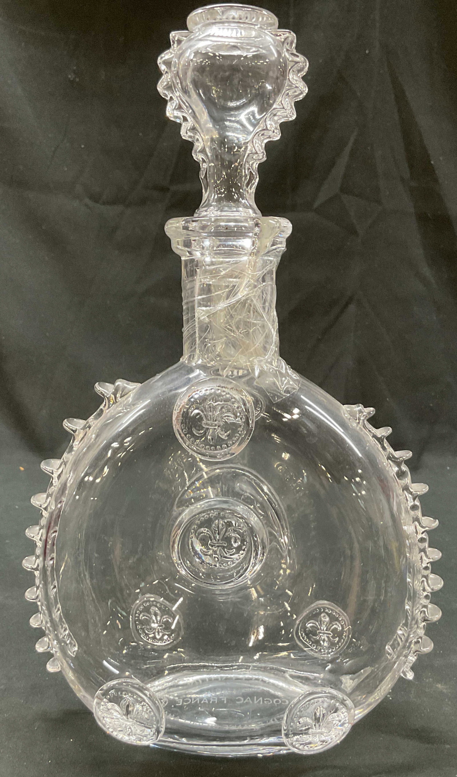 Baccarat Remy Martin Crystal Decanter France: Baccarat Remy Martin crystal decanter. Marked on underside, reads Depose E. Remy Martin & Cie Cognac France Made In France By Baccarat. Distinct fleur de lis medallions and spiny trim along edges.