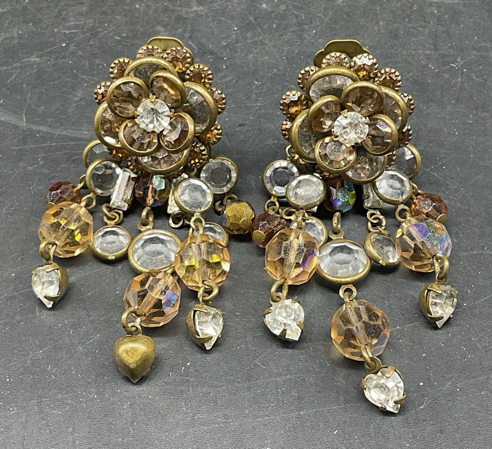 Vintage Gold Tone Crystal Flower Earrings: Vintage gold tong flower earrings with crystal decoration. Measures approx. 2.5 inches long. Some scratching. Jewelry, estate jewelry, costume jewelry, cocktail jewelry, fashion jewelry, accessories,