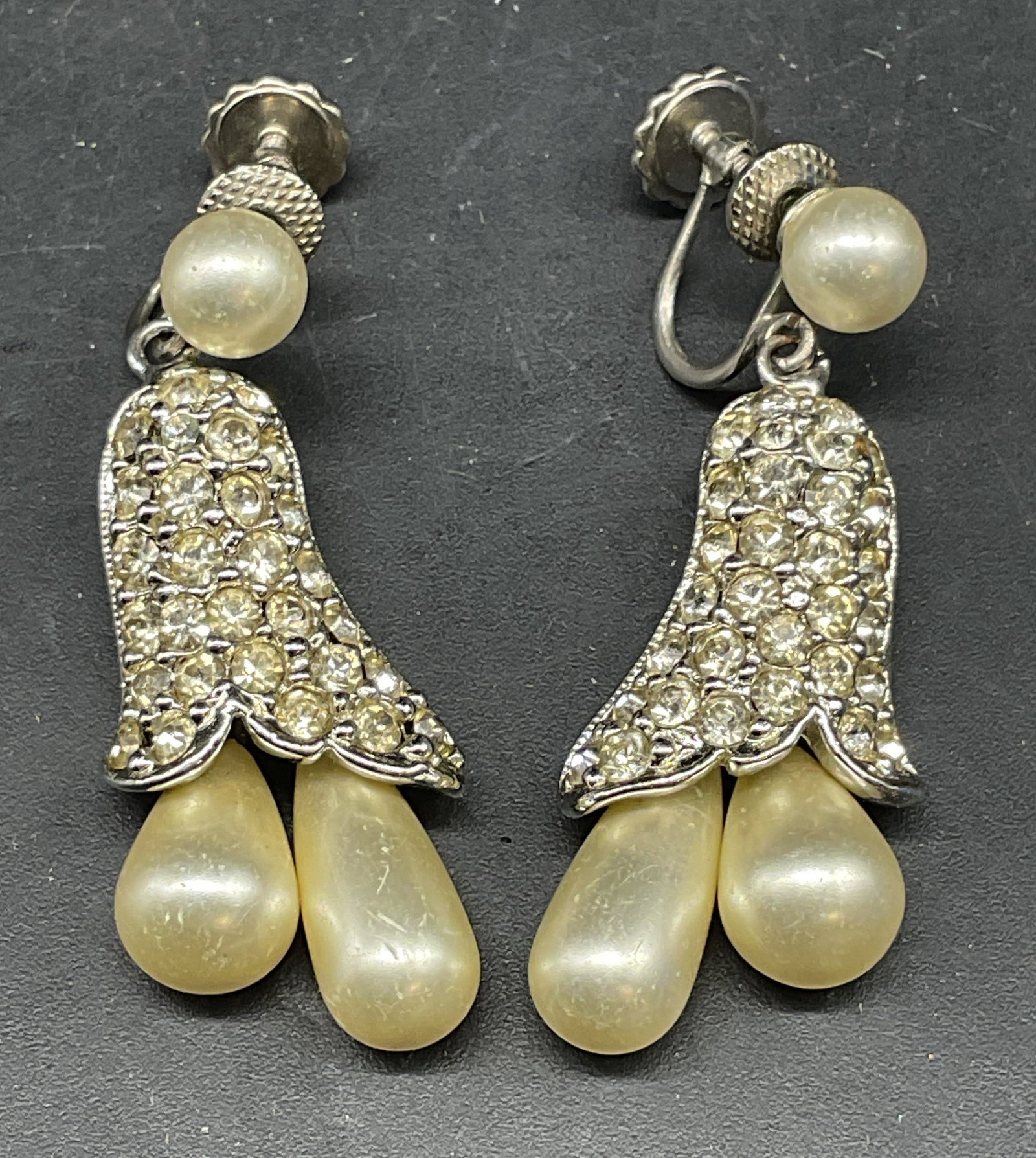 Vtg Richelieu Faux Pearl Crystal Flower Earrings: Vintage signed Richelieu silver tone flower earrings with crystal and faux pearl decoration. Measures approx. 1.5 inches long. Some scratching. Jewelry, estate jewelry, costume jewelry, cocktail