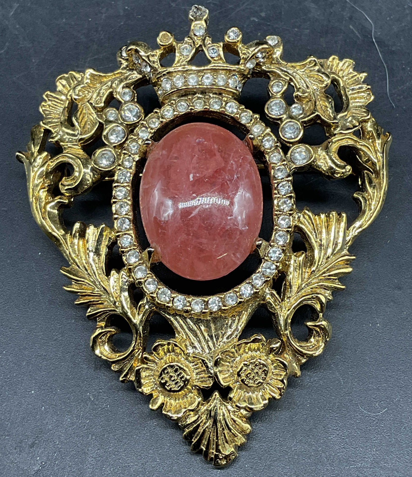 Vintage Gold Tone Pink Stone Crown Brooch: Vintage gold tone ornate heart and crown brooch with pink stone cabochon and crystals. Measures approx. 2.25 x 2 inches. Some scratching. Jewelry, estate jewelry, costume jewelry, cocktail jewelry, fa