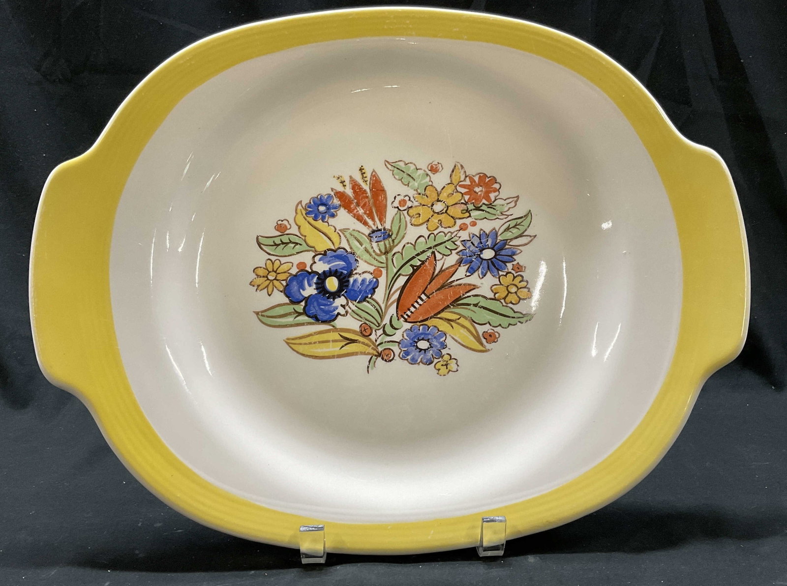 Triumph Limoges Floral Ceramic Platter, USA: Reverse reads Triumph, Made in USA, Limoges, Bermuda, T 6, vintage handled platter, trimmed in wide yellow band, central floral sprig, measures app length 15.5 inches by app 12 inches, some surface