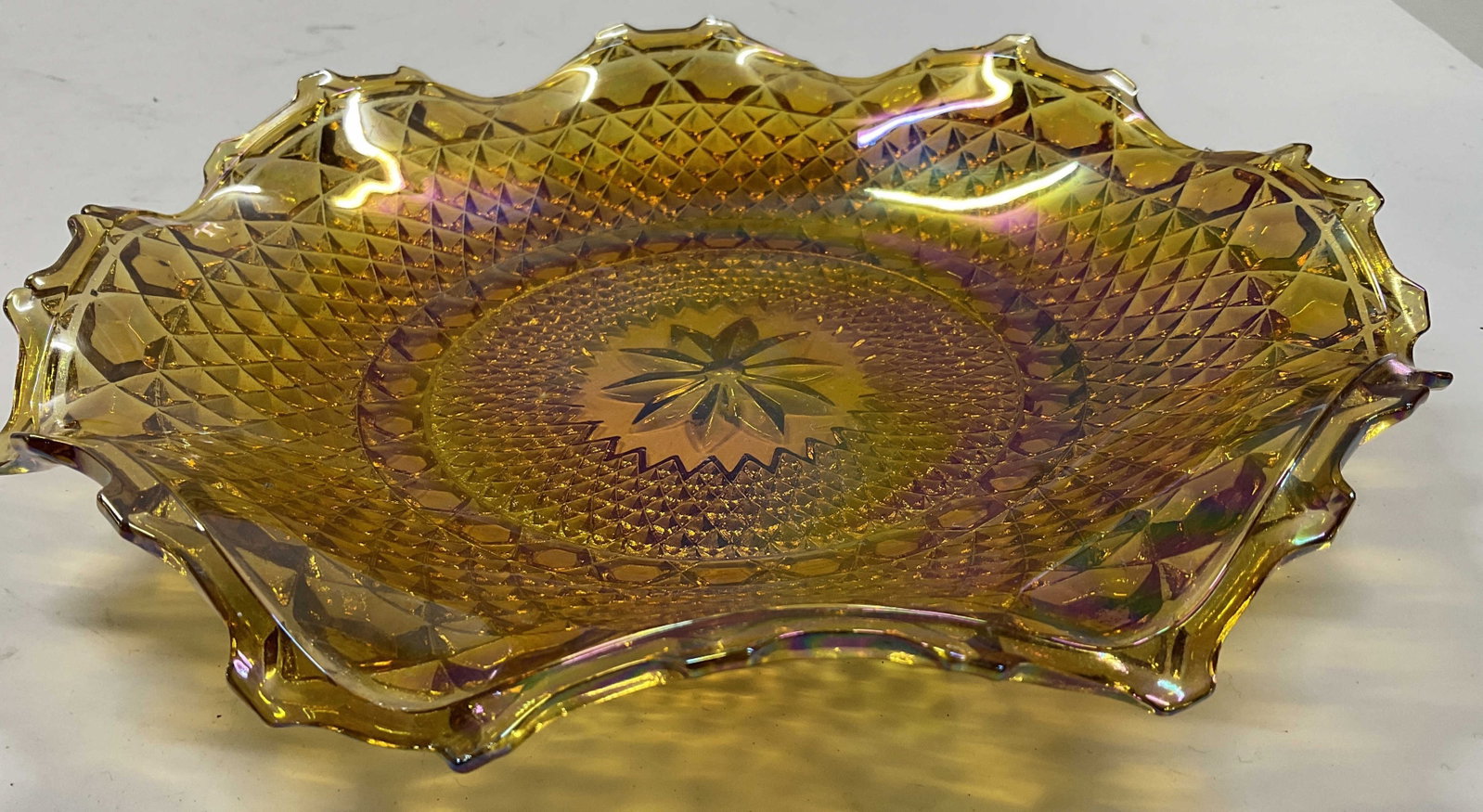 Indiana Carnival Glass Diamond Point Pattern bowl: Vintage tableware, Indiana Glass Company marigold carnival glass bowl with a ruffled edge and textured diamond point pattern , has a ruffled and crimped edge, shallow bowl shape, measures diameter