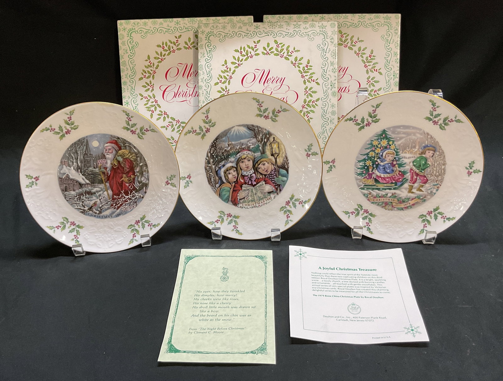 Lot 3 Royal Doulton Xmas Plates England W Box: Lot of 3 Royal Doulton bone china Christmas plates. Marked on underside as photographed here. Made in England. Years include 1979, 1980, and 1981. Comes in original box. Motifs include figures,