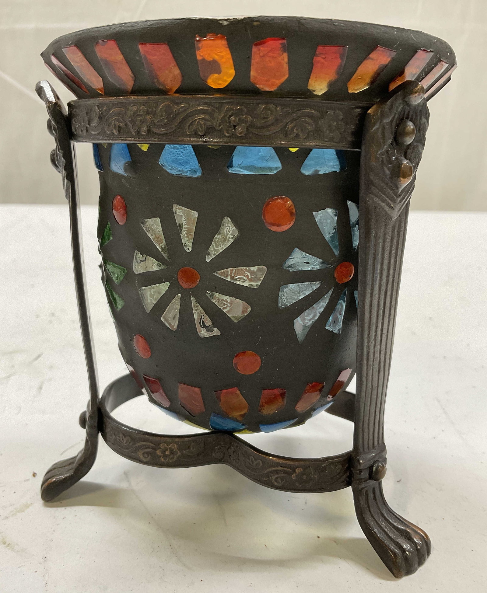 Mosaic floral and metal candle holder: Glass mosaic in ceramic vase rests in footed metal frame, measures app ht 5 inches diameter app 4.5 inches, table decor, decorative object