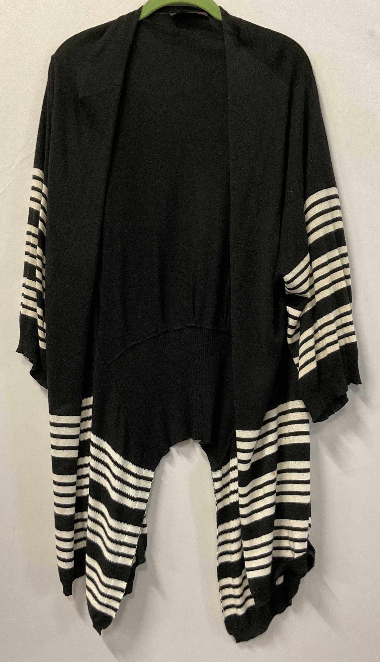 Penelope Leroy Black & White Striped Open Cardigan: Penelope Leroy black and white striped open cardigan. 70% rayon 30% cotton. Measures approx 17 inches across chest. Black with white stripes. Split seam design. Wear consistent with exposure,