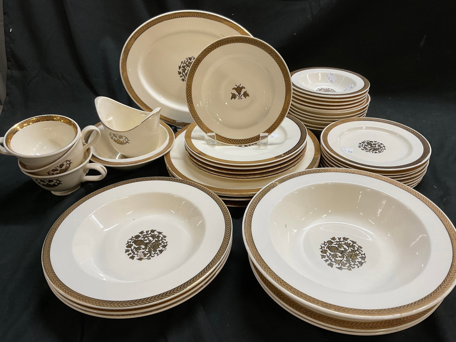 40 PCs Partial Set Taylor Smith And Taylor Gold: White, USA Pattern Is 22K gold trimmed banding and center floral medallion, porcelain marked on underside for Taylor Smith and Taylor that produced this pattern in USA 1980s, partial Set includes one 