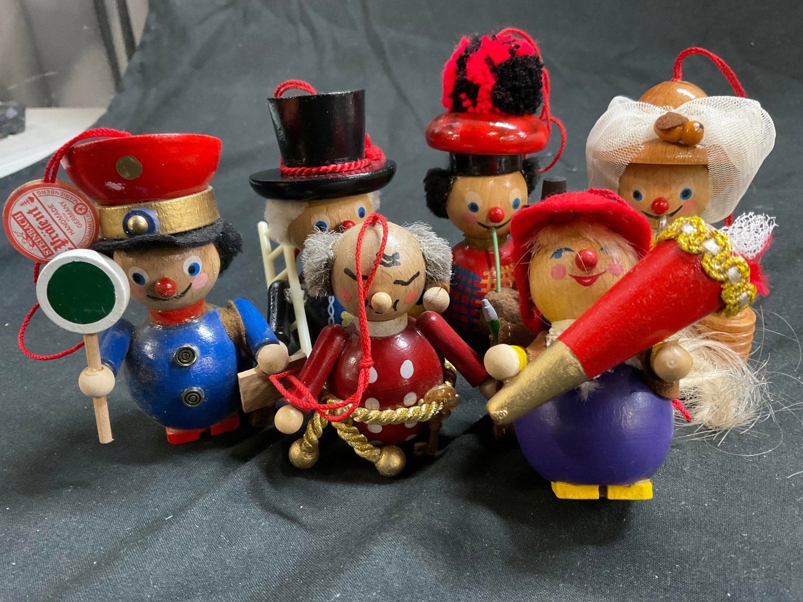 6 Steinbach West German Wood Ornaments: Set of six German whimsical carved wood figurals, with hats, accessories, clothing, costumes and painted faces, man with bag pipes measures ht 4.5 inches, collectible Christmas ornaments, holiday vint