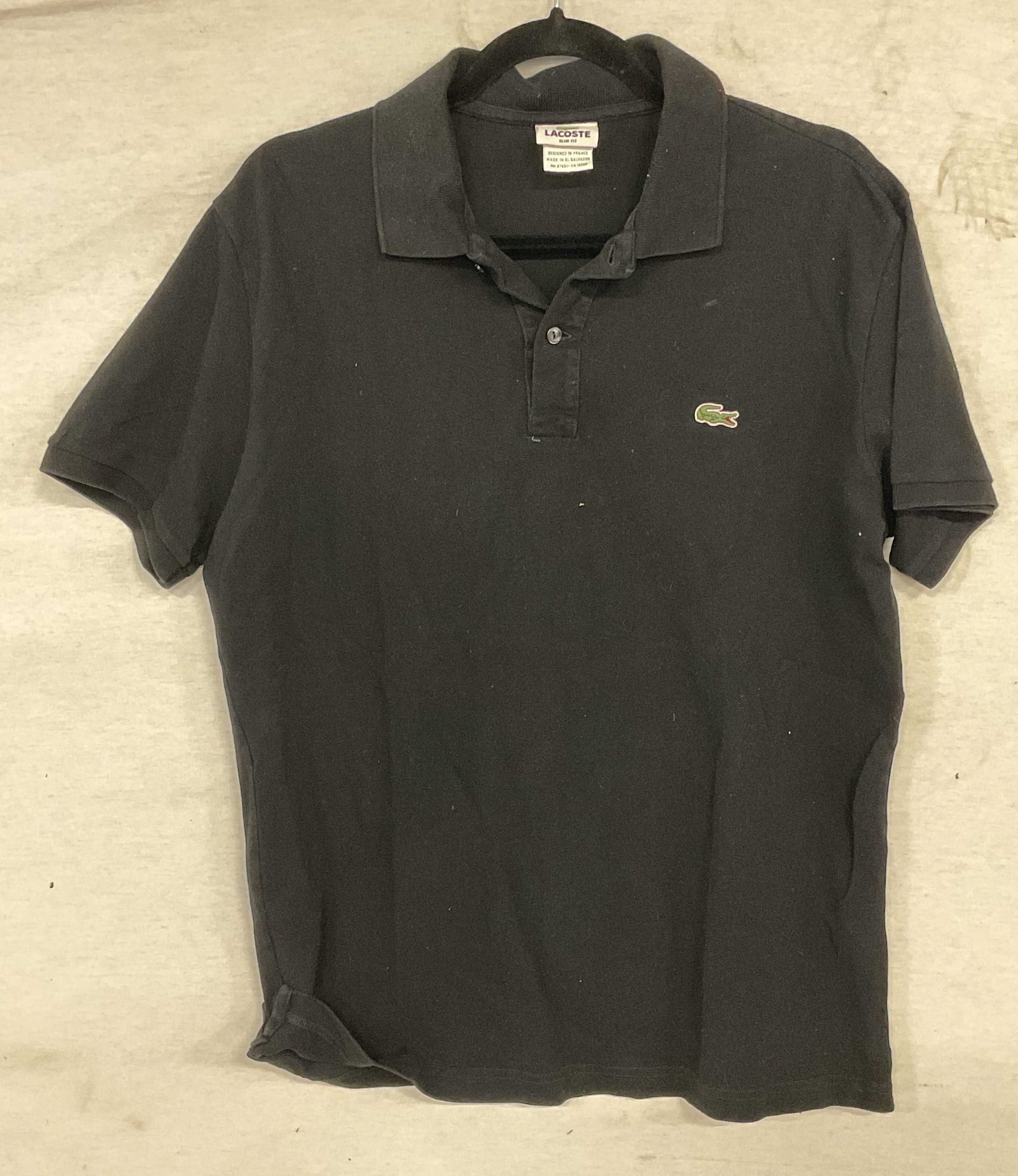 Lacoste Black Cotton Polo Shirt: Lacoste short sleeve polo shirt in black. Cotton. Size marked 6. Some blemishes. Lacoste shirt, polo shirt, short sleeve shirt, black shirt, 10 h