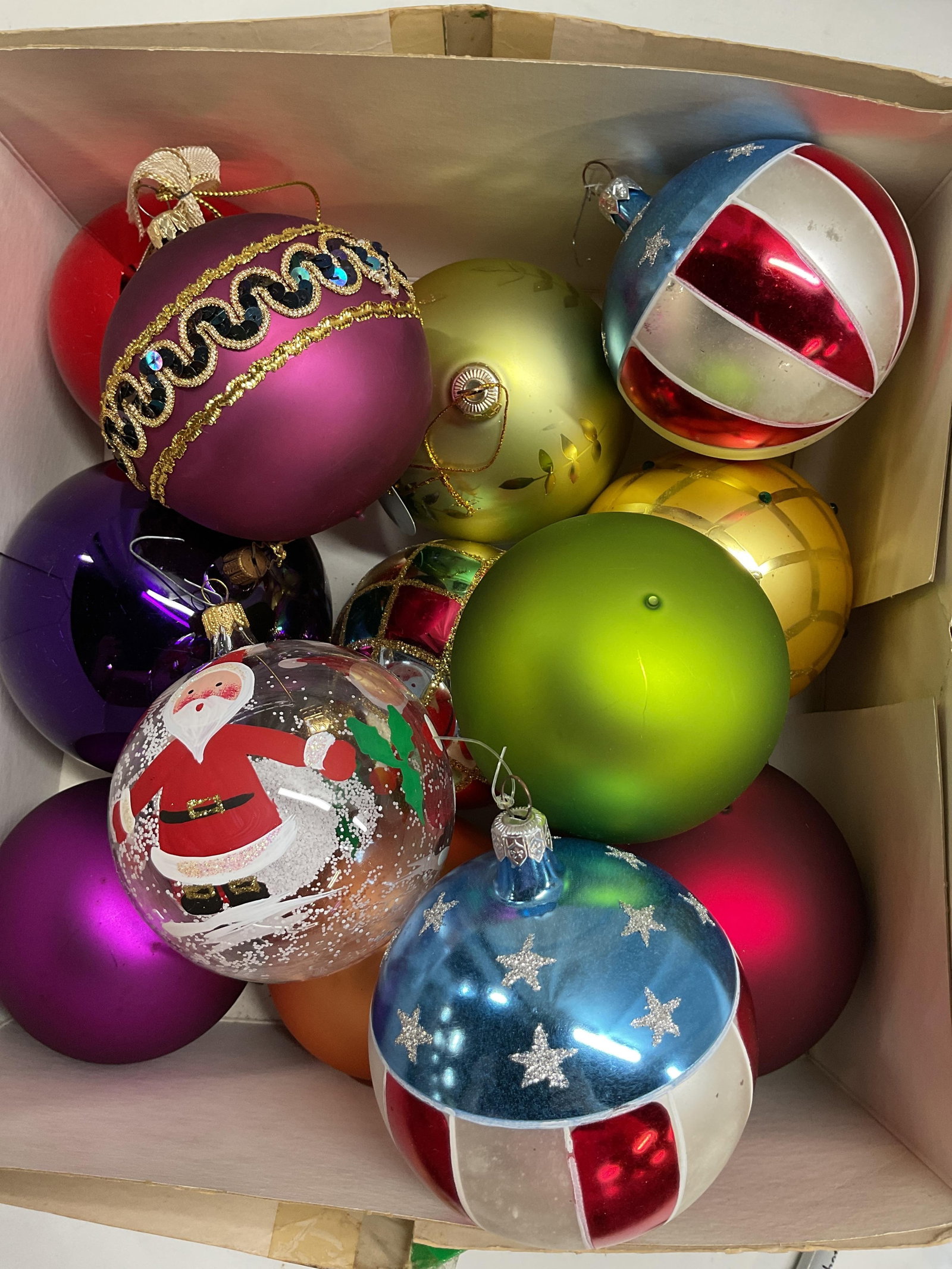 Group large decorative Glass Christmas balls: Purple red , Chartreuse, red white and blue, painted Santa, leaf, diamond design and more, each measures approx 5 inch diameter, bulk