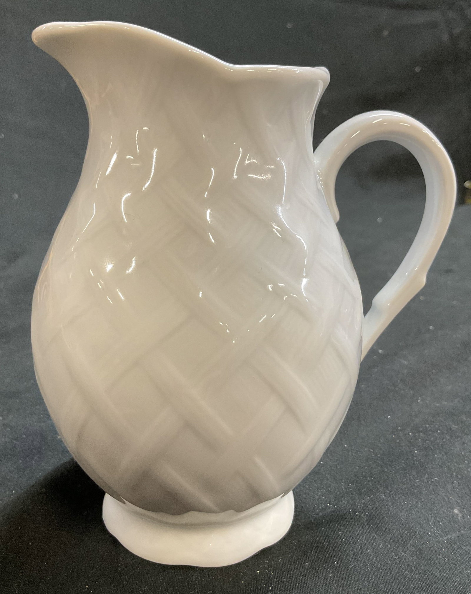 BERNARDAUD Limoges France Vannerie Creamer: Porcelain creamer in Vannerie pattern of raised lattice work design white on white, marked underside for BERNARDAUD Limoges France, ht app 5.5 inches, smalls