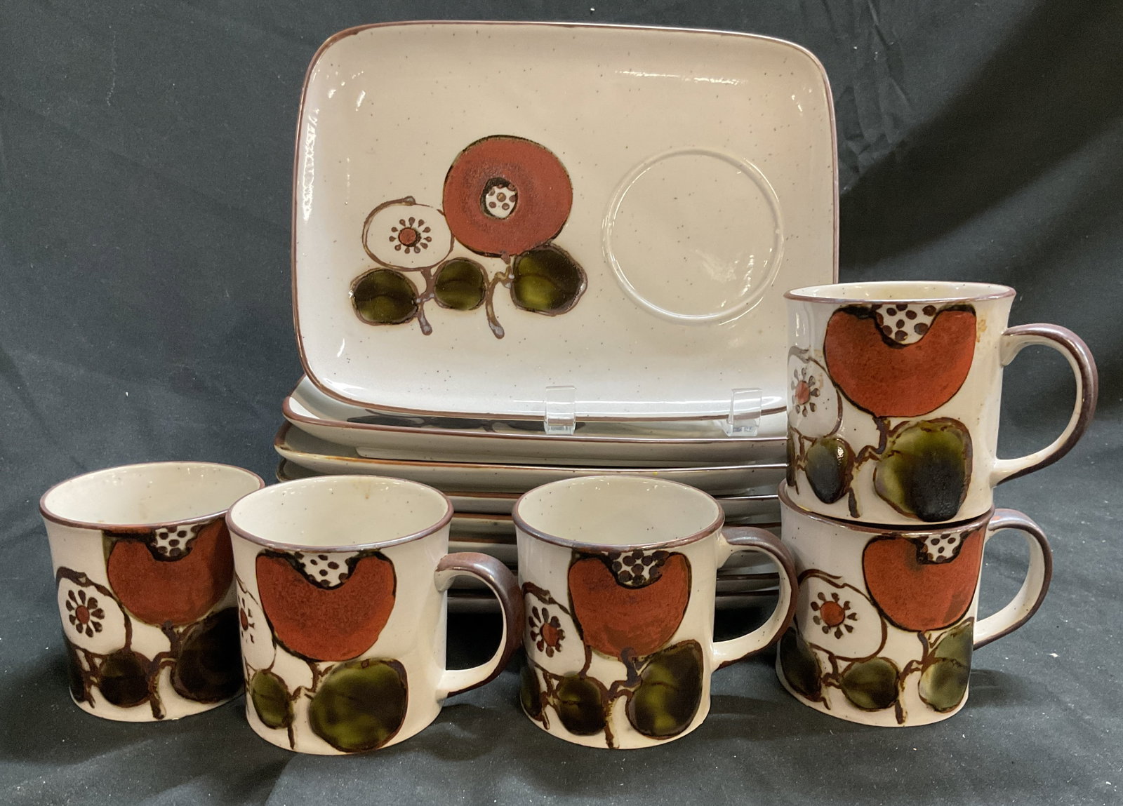 Set 13 pcs Otagiri Stoneware Tableware, Japan: Otagiri stoneware featuring a speckled beige glaze and a rustic fruit and geometric design, set has 8 rectangular buffet plates measuring 10 inches by 7.5 inches, each has circular inset for mug or