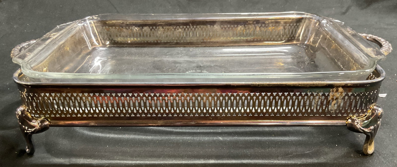 Silver Plate Pierced Footed Serving Stand w Pyrex: Silver plate rectangular server with pierced gallery, double handles rope twist design, scrolled short feet, comes with Pyrex insert, measures 16 inches length 9 inches width and ht app 3.5 inches,