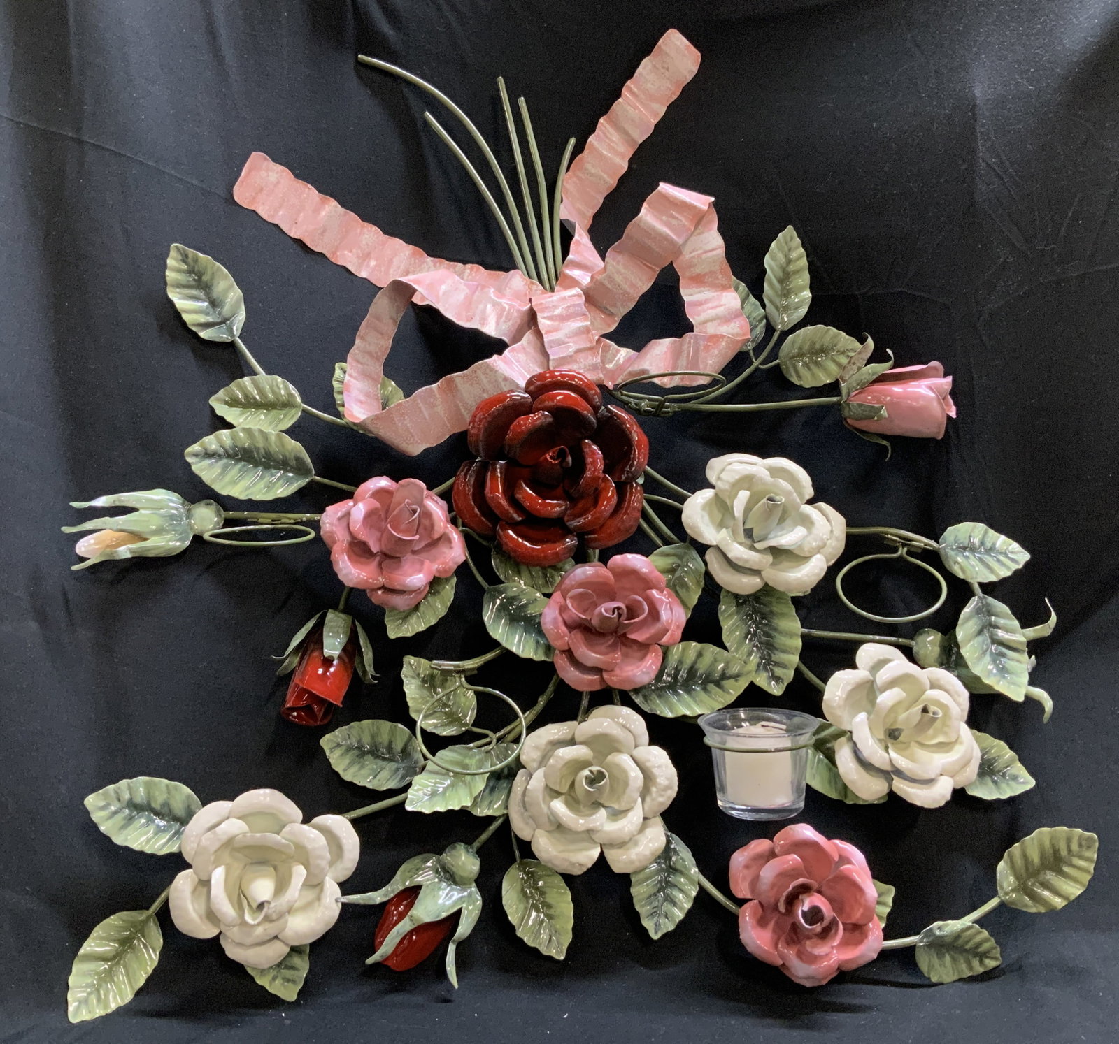Decorative Hand Painted Floral Wall Sconce 22in: Decorative metal wall sconce featuring hand painted roses & leaf motifs. Pink, red, white & green. Ribbon accent at top. Holds 5 candles. Metal material. No visible signature or markings. Surface wear