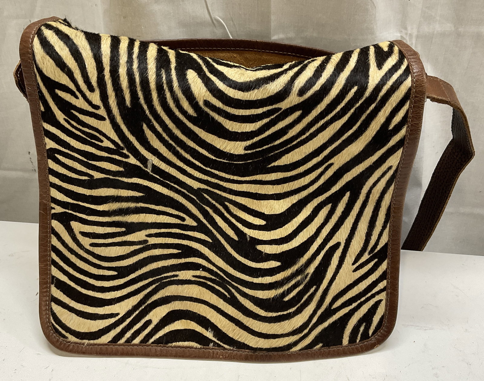 VTG Zebra Calf Hair & Brown Leather Messenger Bag: Vintage Zebra Patterned Calf Hair and Brown Leather Messenger Bag. Surface Wear to Hair and Leather Present. Measures app 11.5in H x 15in W. Vintage Bags, Zebra Pattern, Calf Hair, Brown Leather, Leat